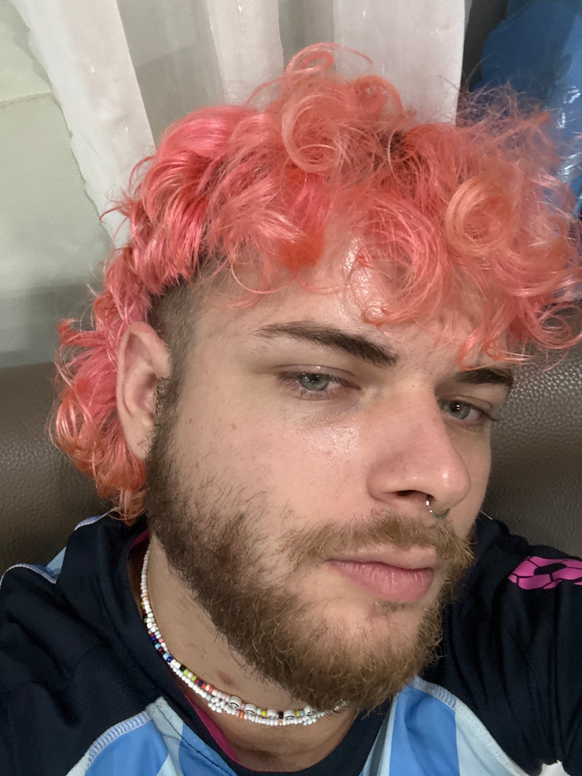 Pink-haired man photographed in Đà Nẵng indoor portrait session