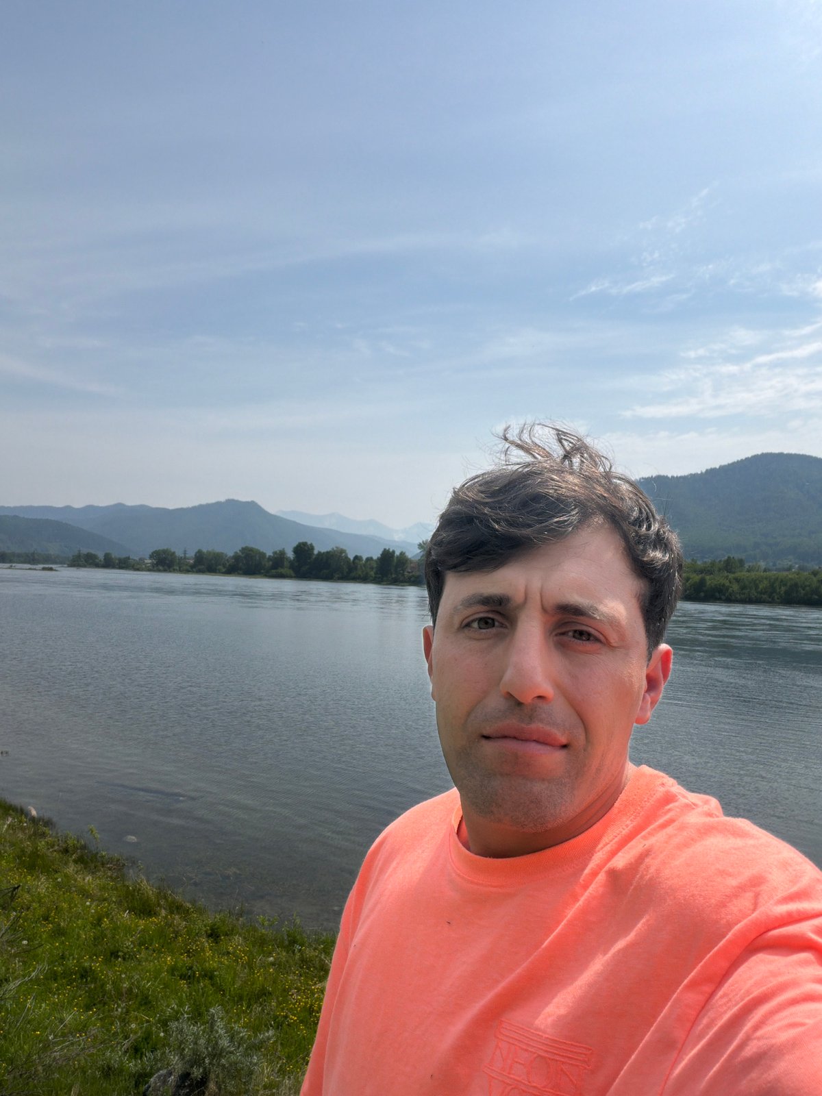 Tourist captures selfie, landscape photos by Siberian river