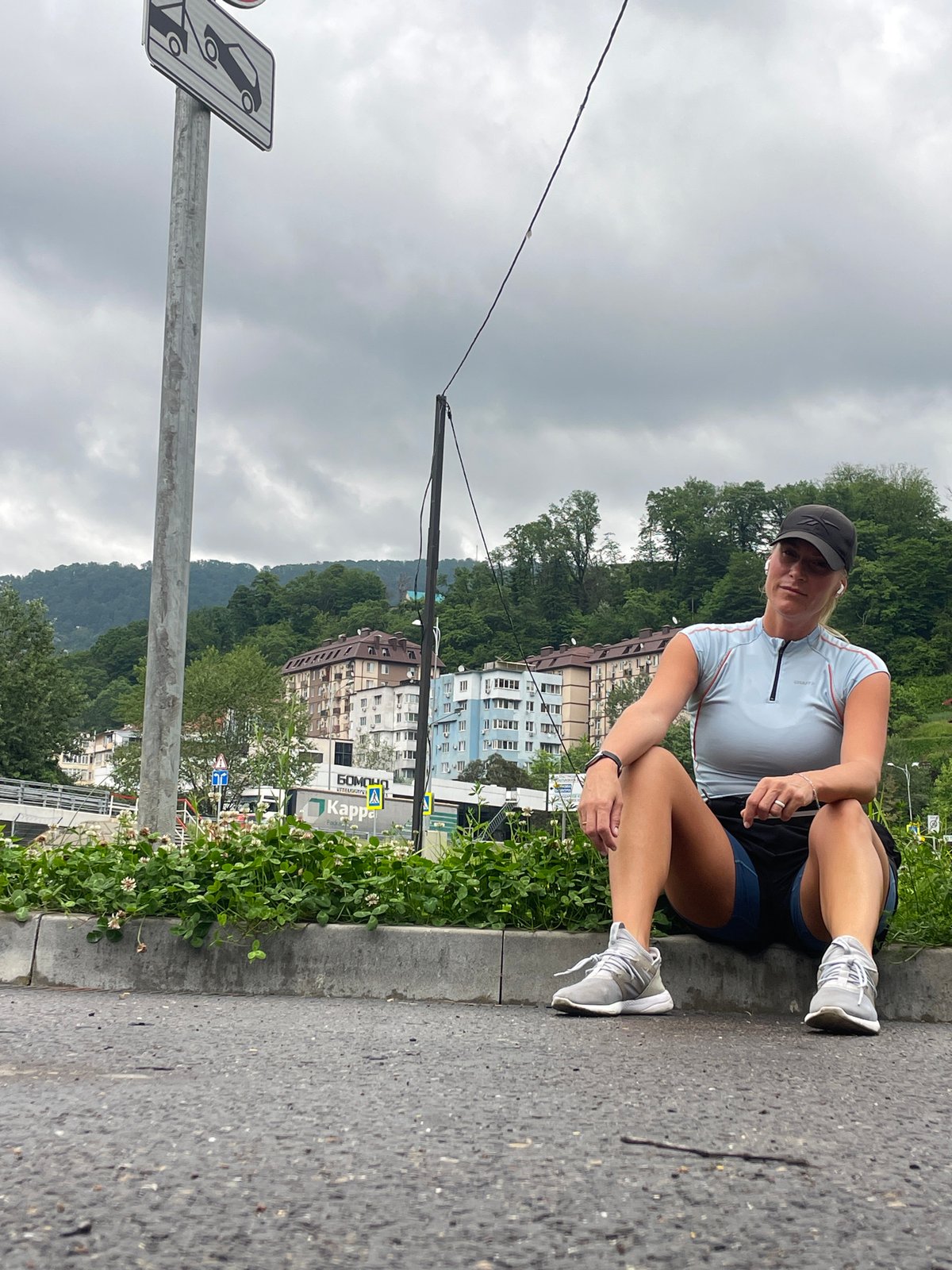 Woman jogs, rests during early morning exercise in Sochi