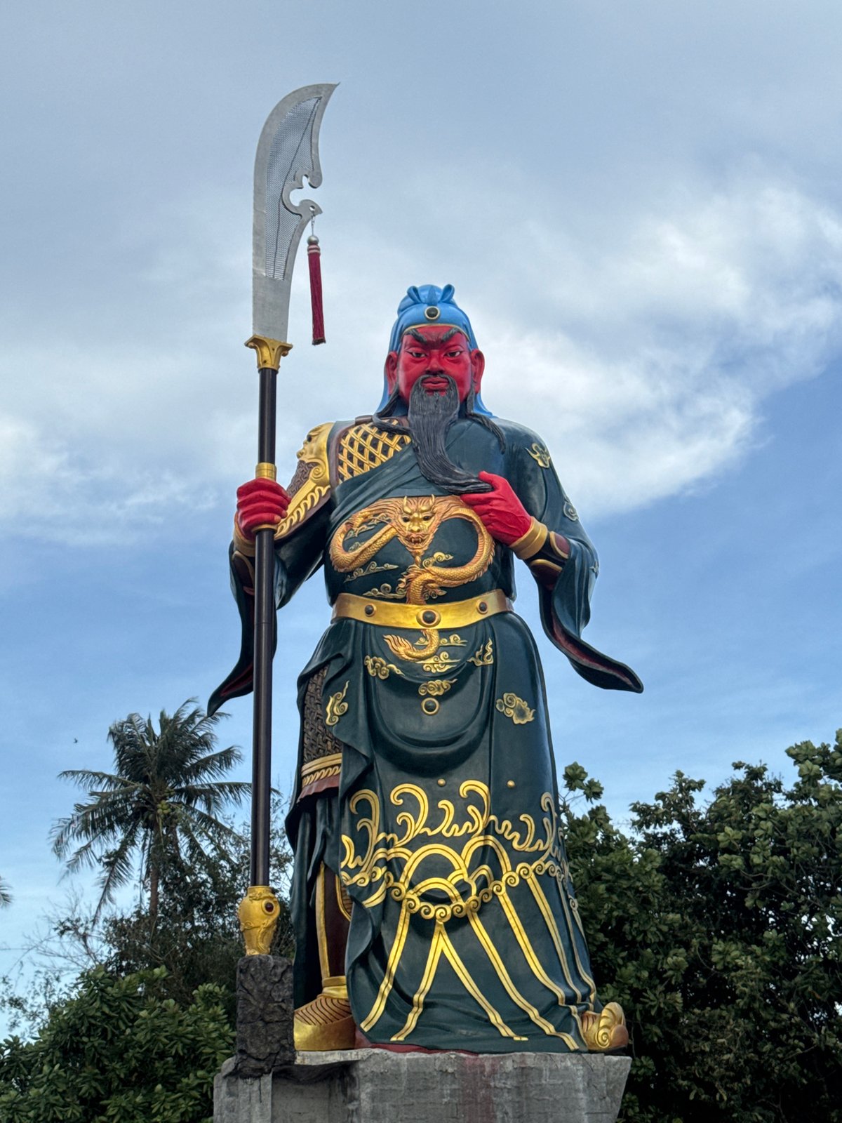Visitors document giant Guan Yu statue in Si Sunthon Thailand