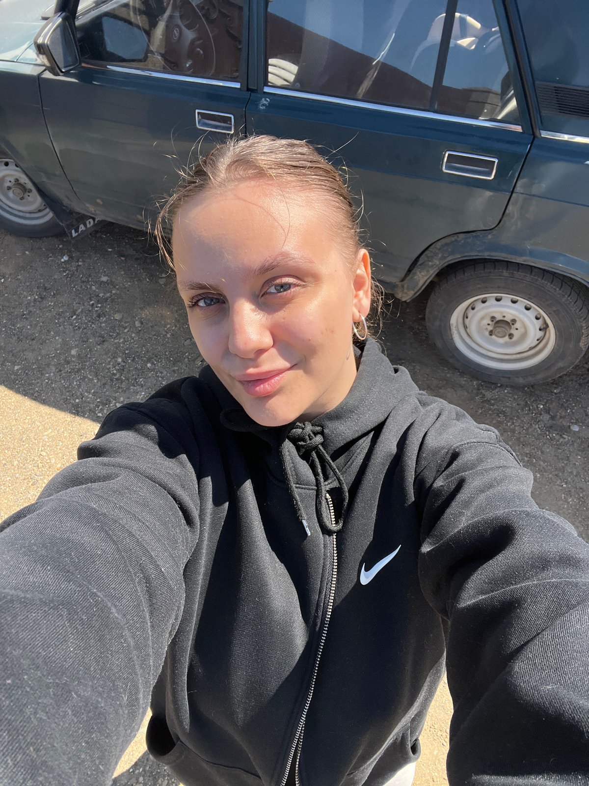 Morning photo documentation captures woman's casual moments in Ольховка