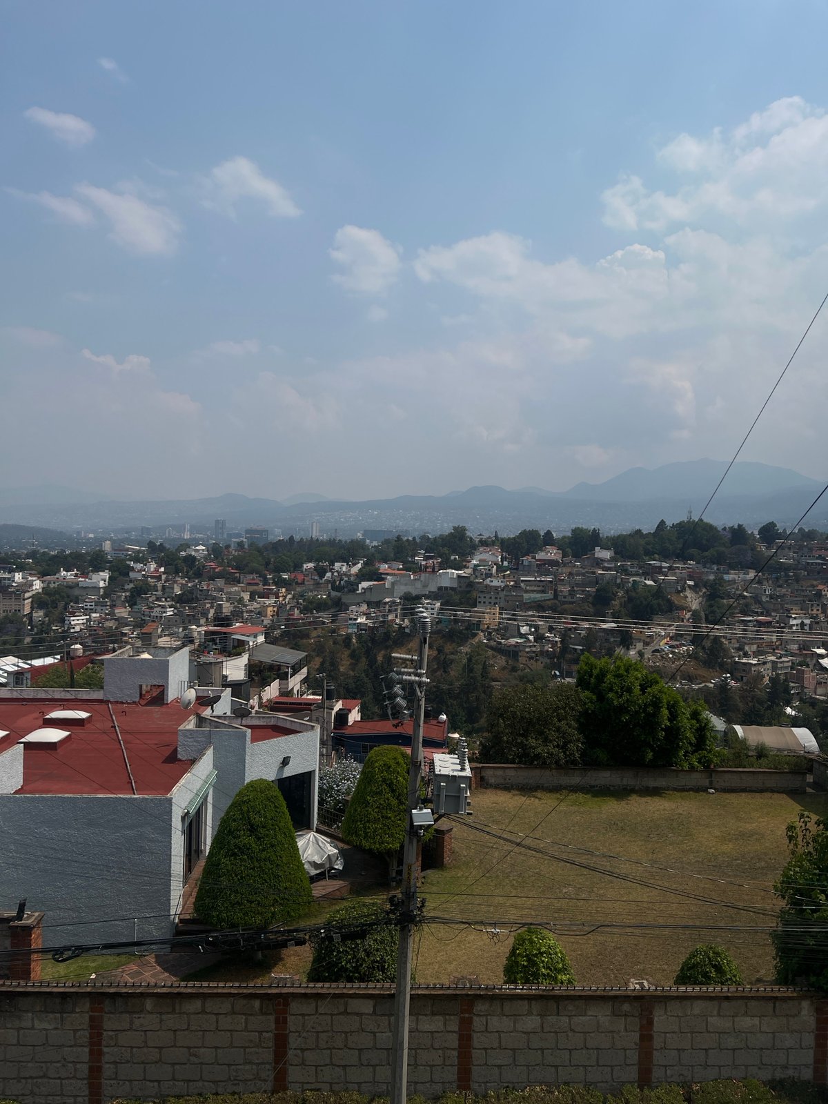 Evening cityscape view captures Mexico City's sprawling residential districts