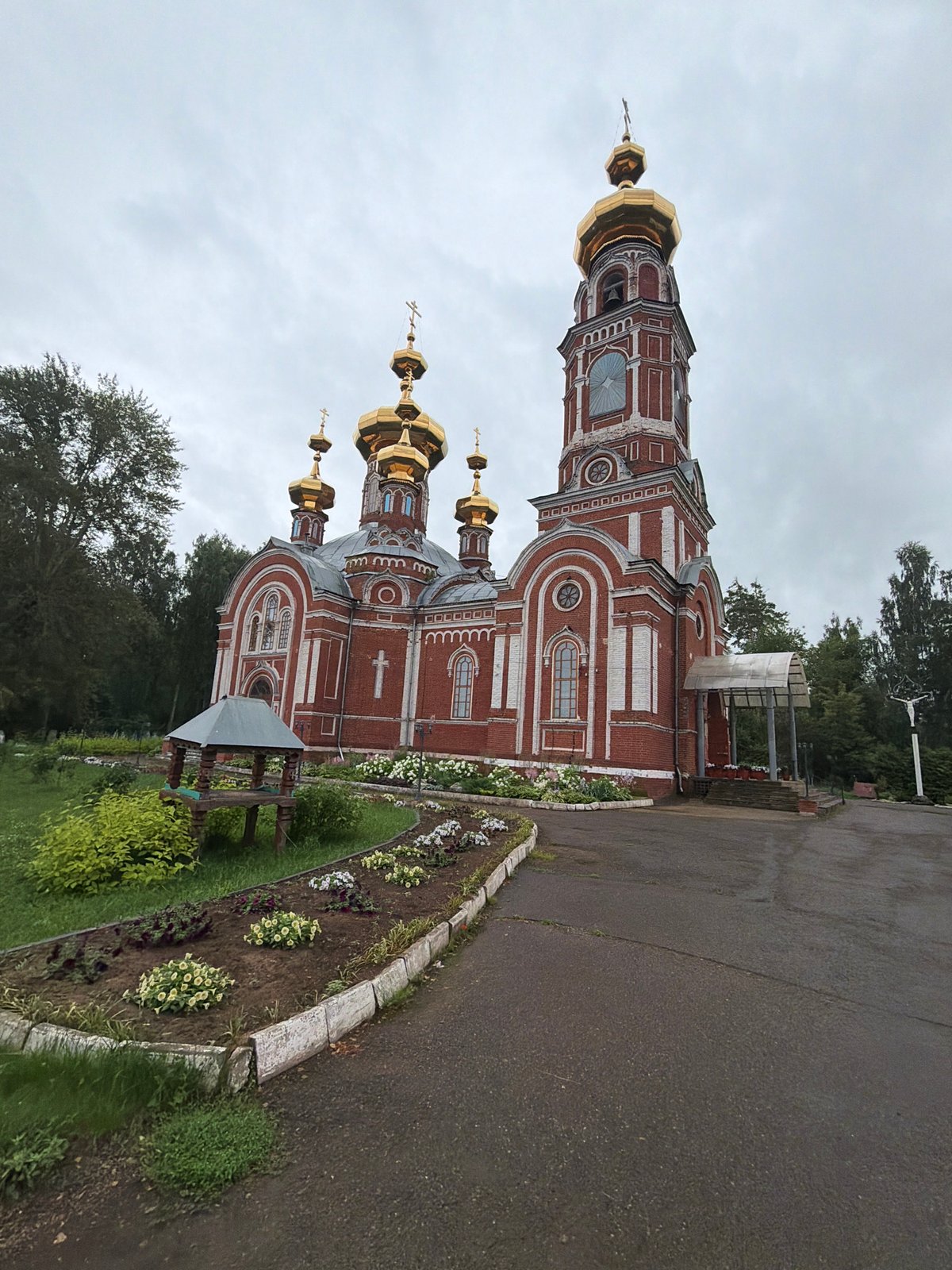 Orthodox church with golden domes in Osa, Russia