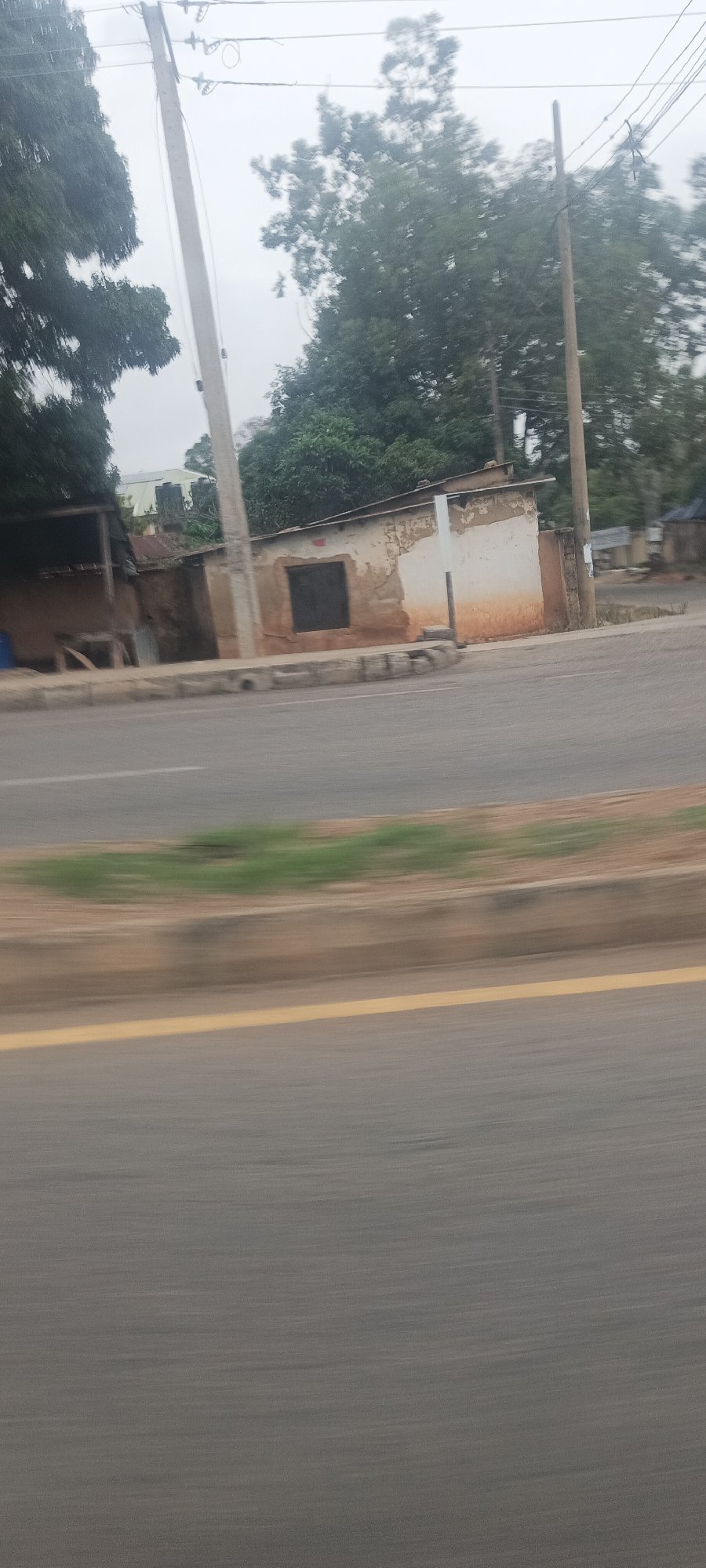 Vehicle journey documented through motion-blurred photos in Jos, Nigeria