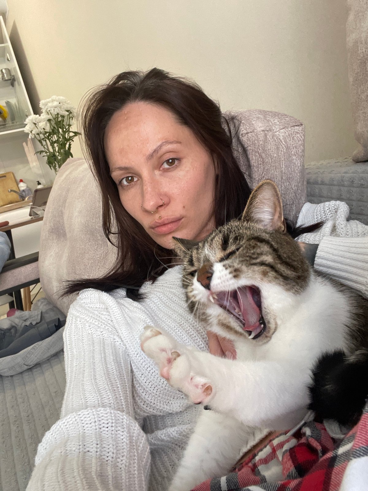 Woman and cat photographed together in Izhevsk home