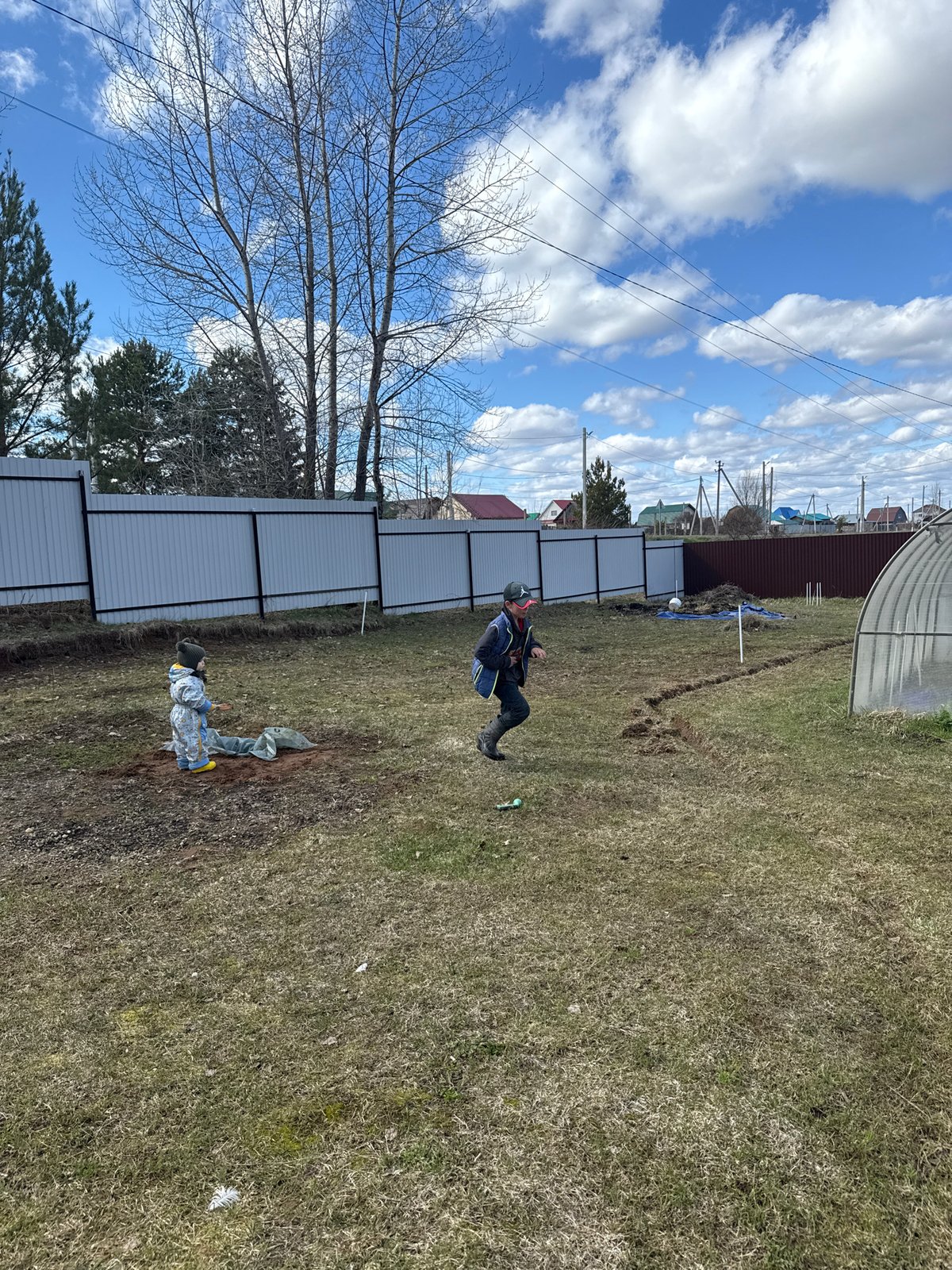 Spring day suburban life captured in Ольховка, Russia