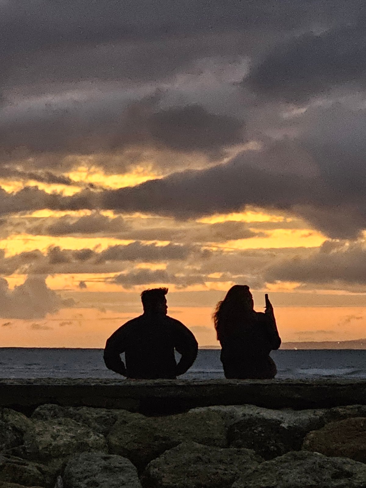 Cloudy sunset draws people to Sanur Beach, Denpasar