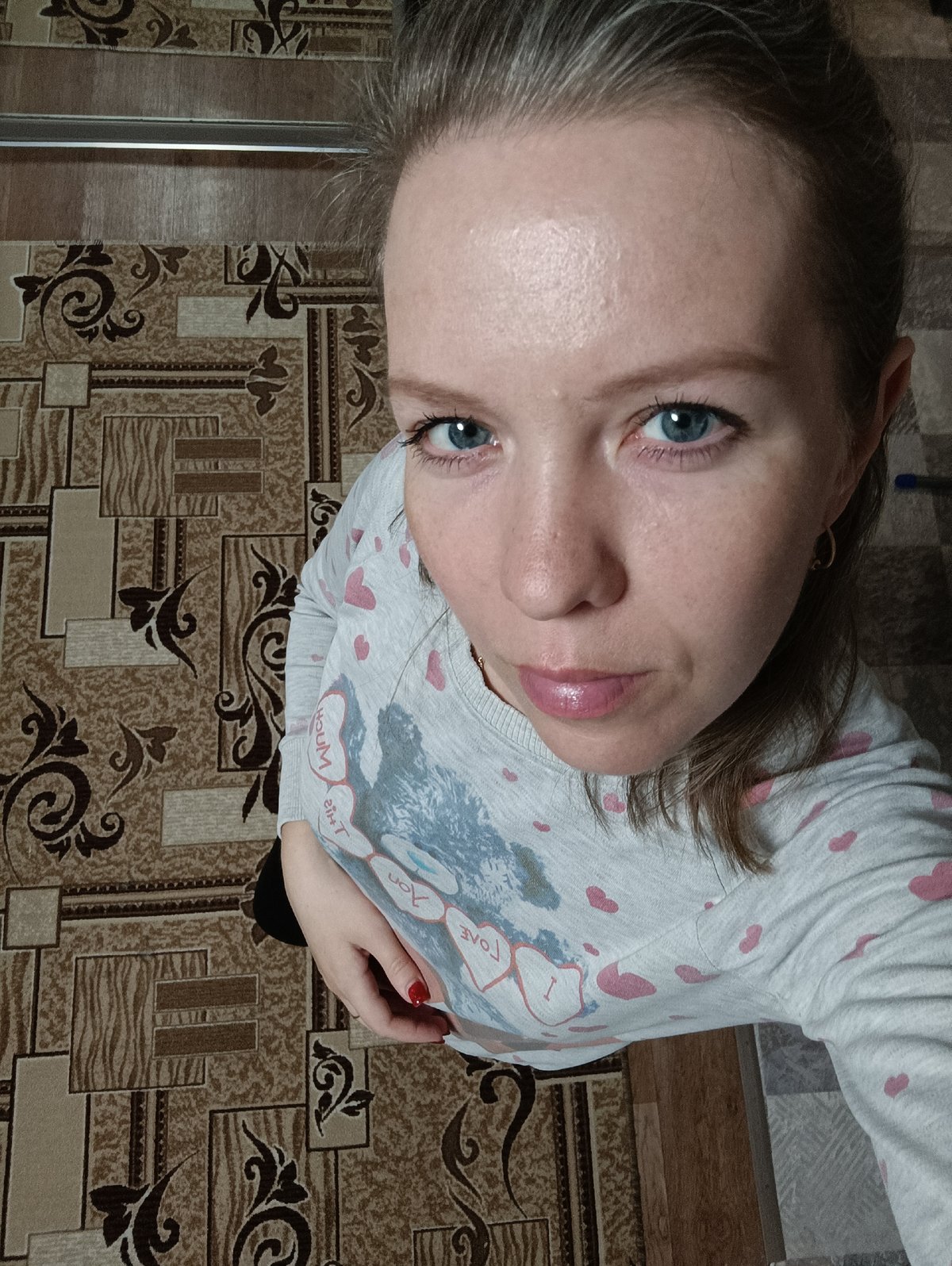Woman photographed in Chaikovsky wearing heart-patterned shirt