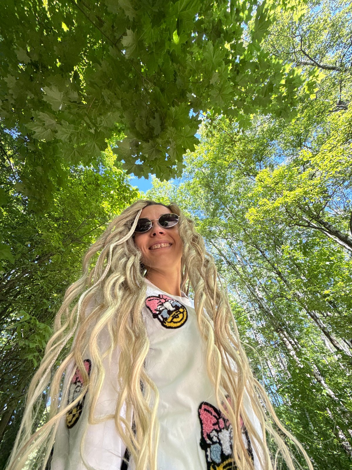 Woman takes forest selfies with child in Rusanovo