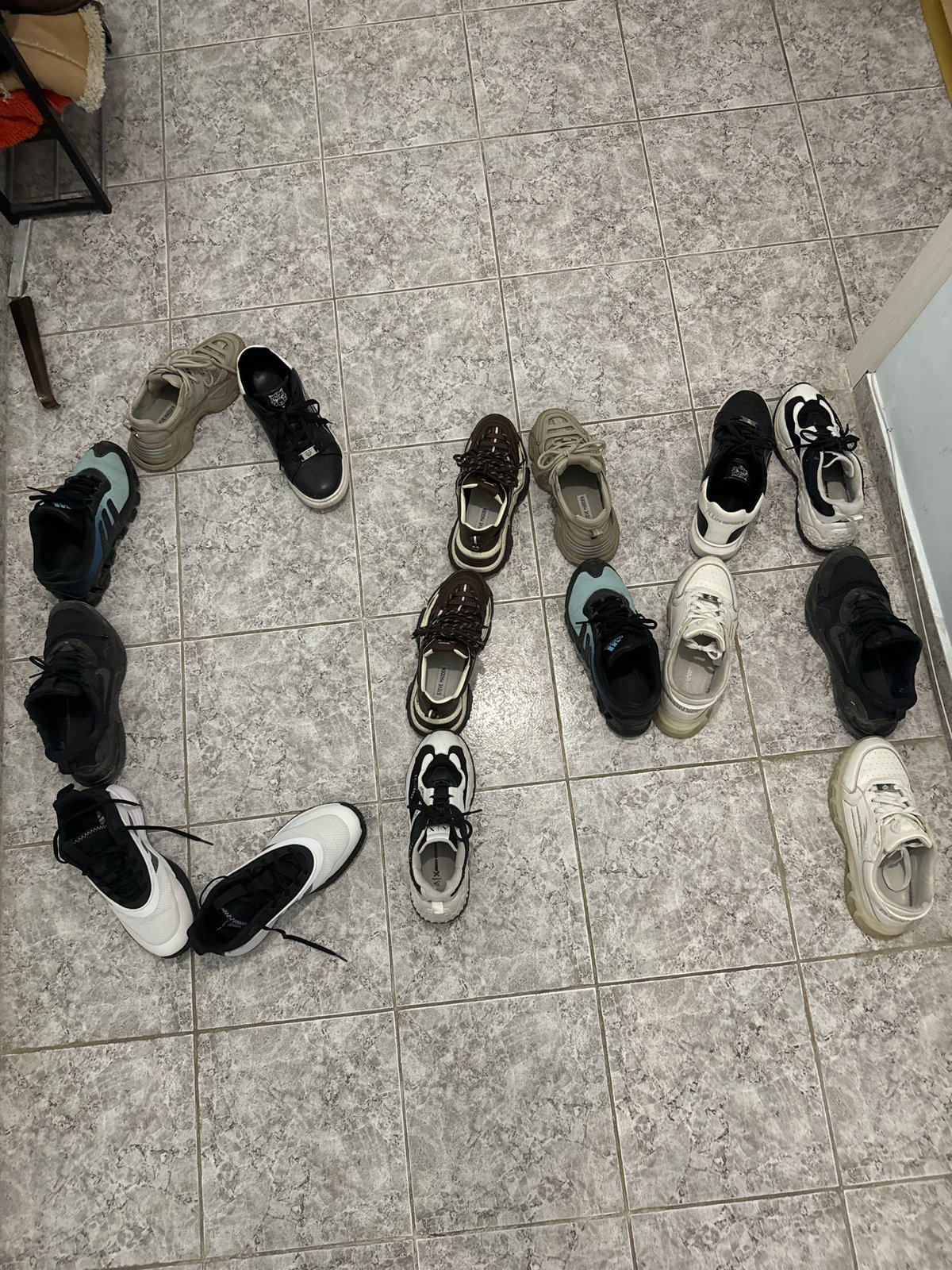 Person arranges shoes in patterns, requests sneaker money in Varna