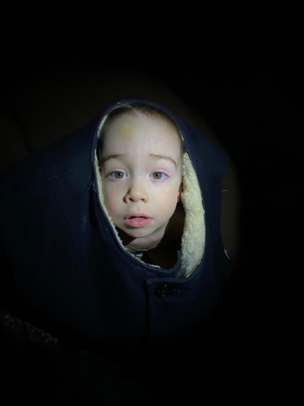 Child photographed in winter clothing in Ольховка, Russia