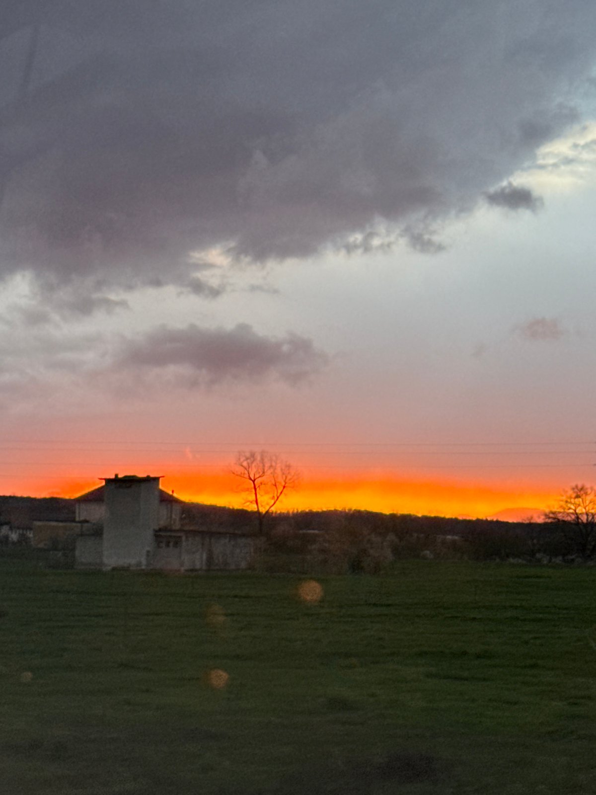 Dramatic sunset observed beneath cloudy skies in Draganovtsi, Bulgaria