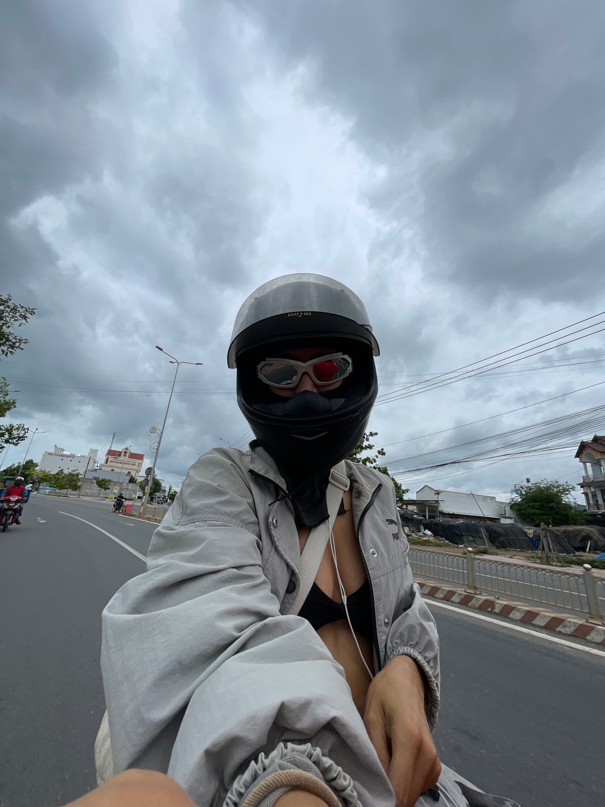 Motorcycle ride through Phu Thuy Ward on a cloudy day