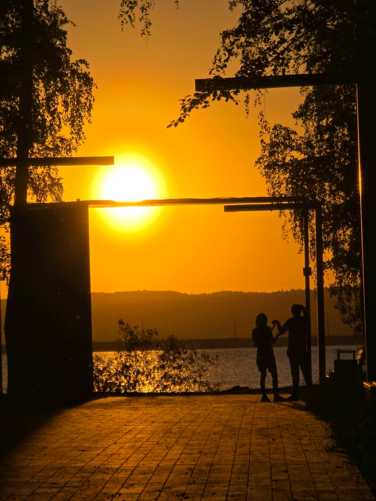 Families enjoy sunset evening at Chaikovsky park and reservoir