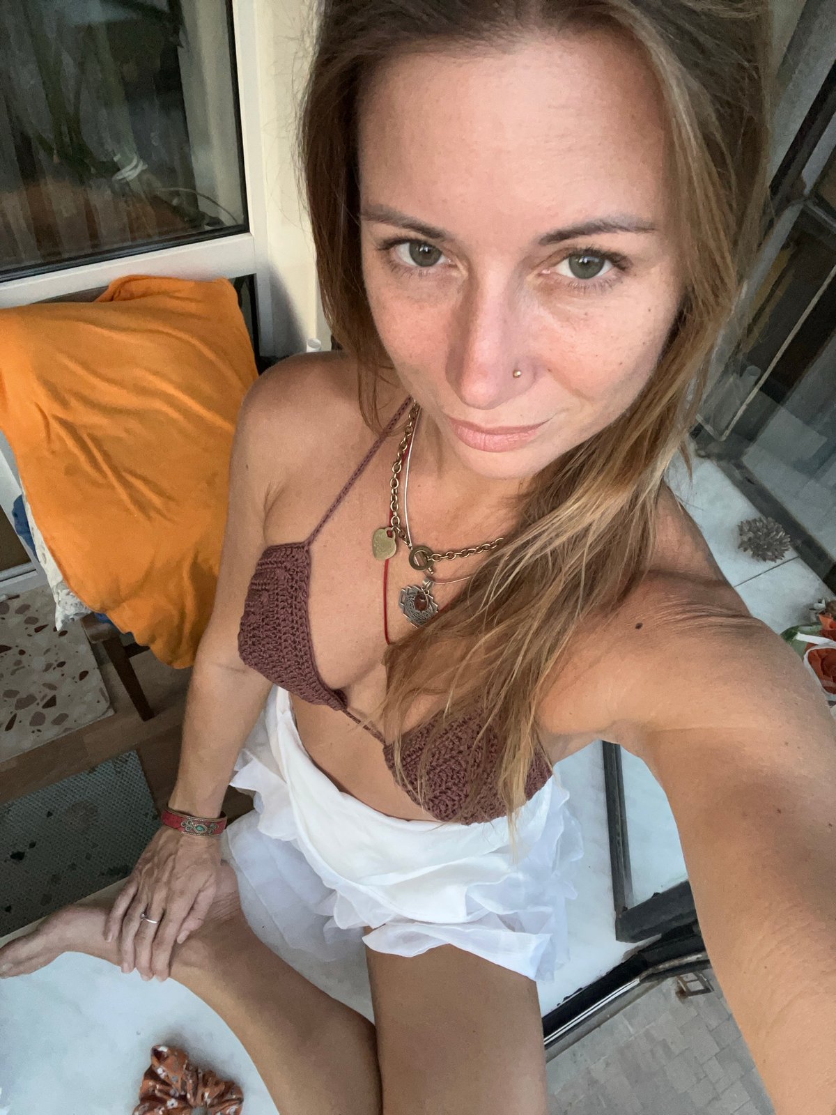 Relaxed windowsill pose in Samara, Russia