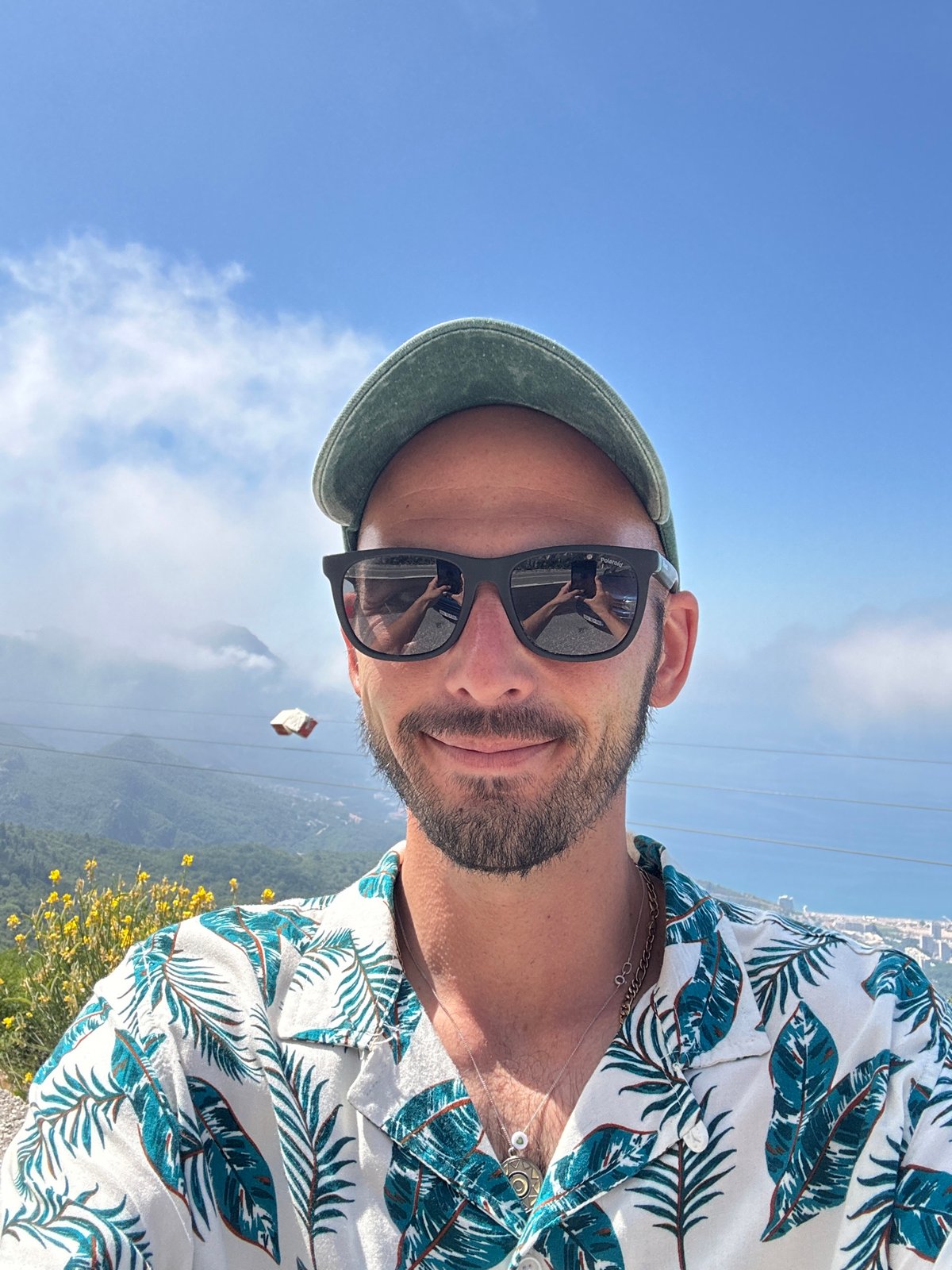 Tourist captures selfies overlooking Adriatic coast in Montenegro