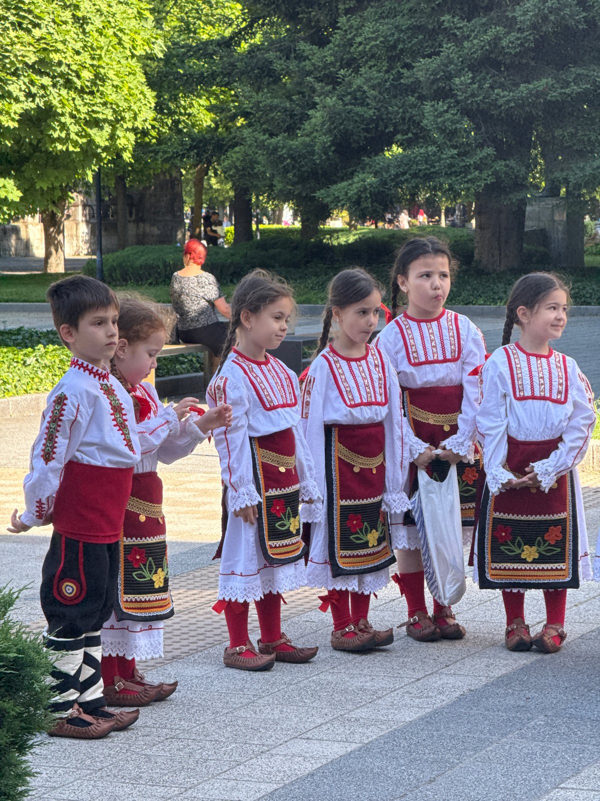 Morning scenes in Pleven: folk costumes, theater, sunlit cat