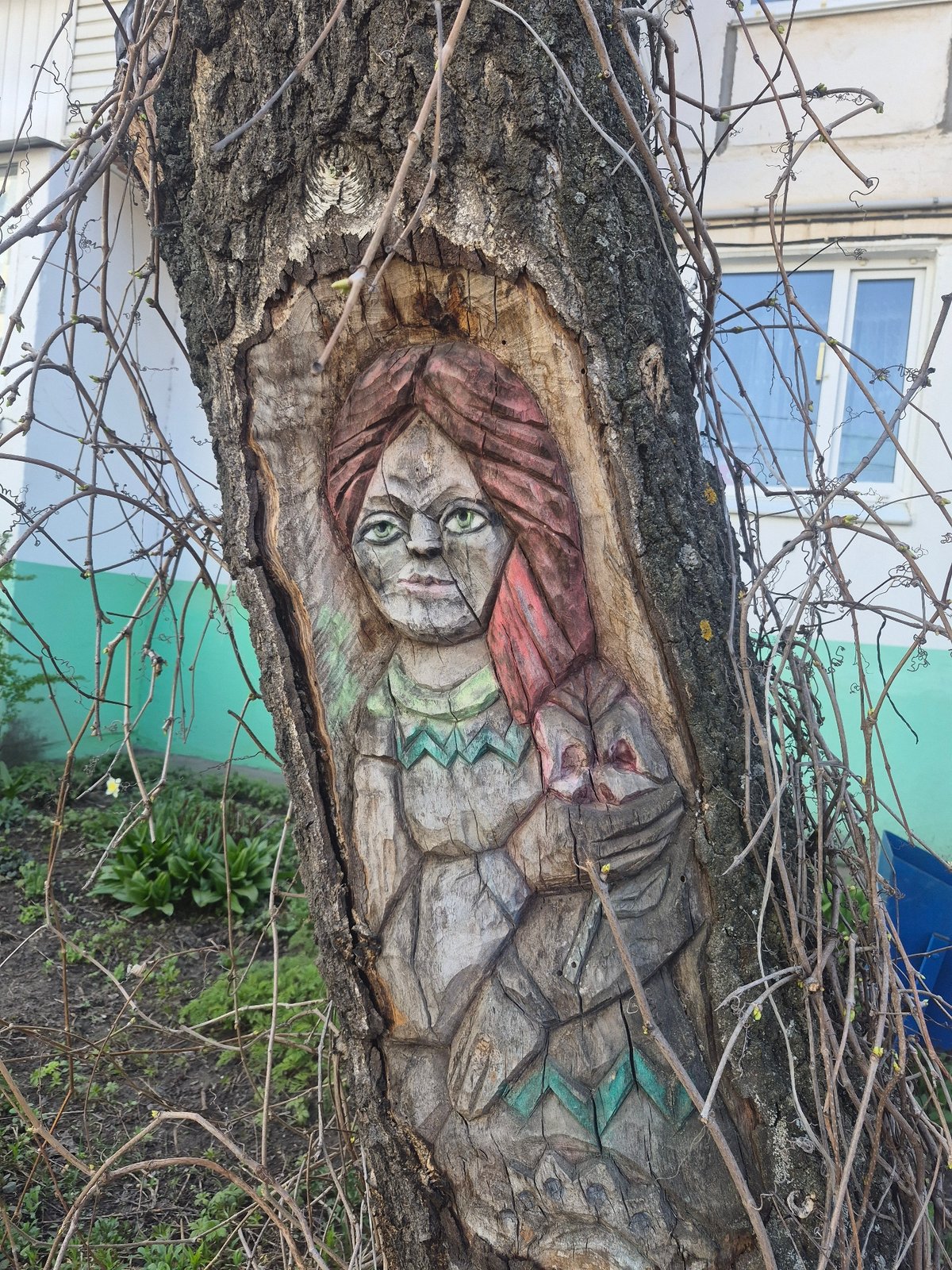 Public art carving and car selfie documented same location