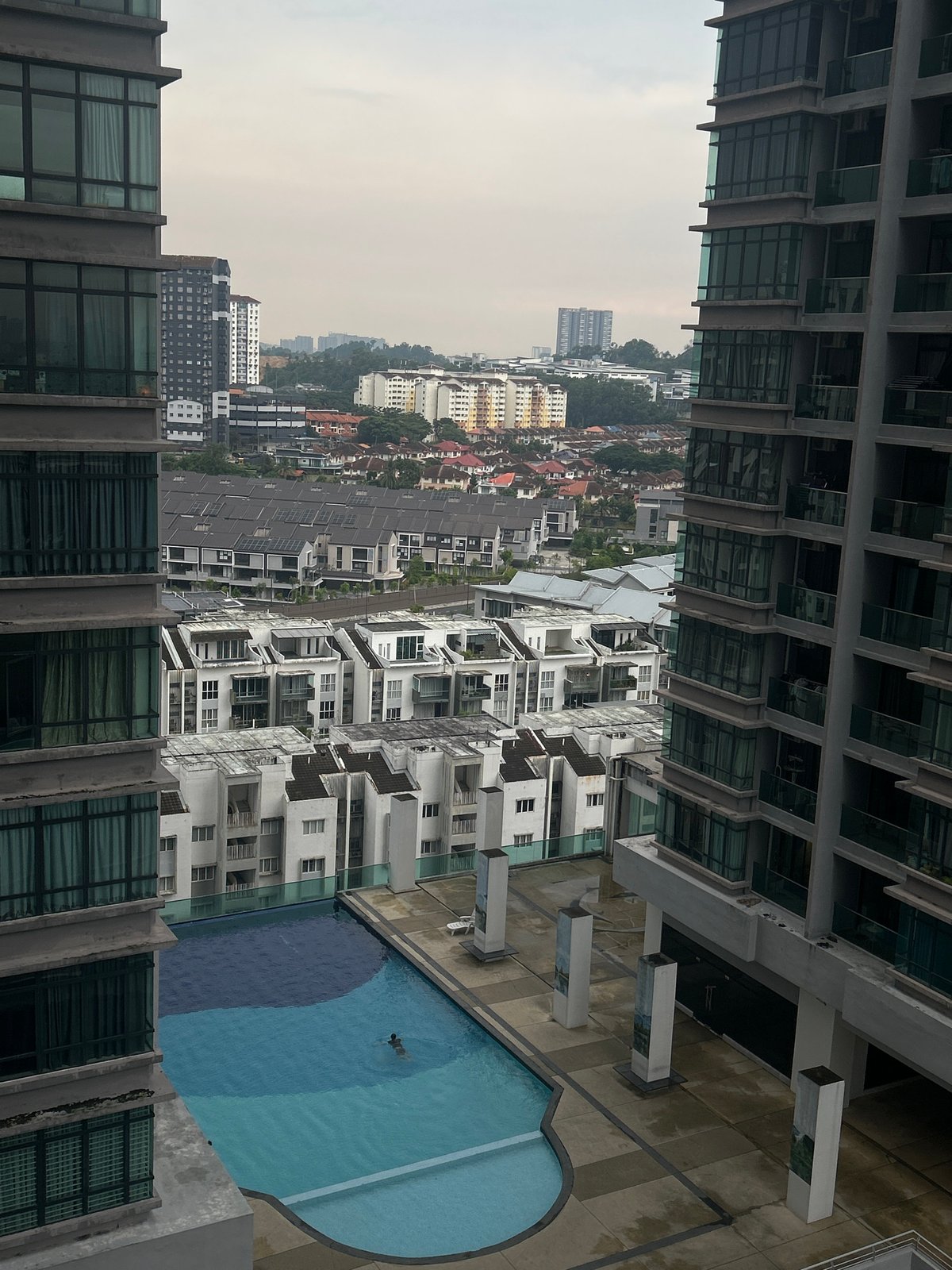 High-rise observer documents overcast morning scenes across Kuala Lumpur