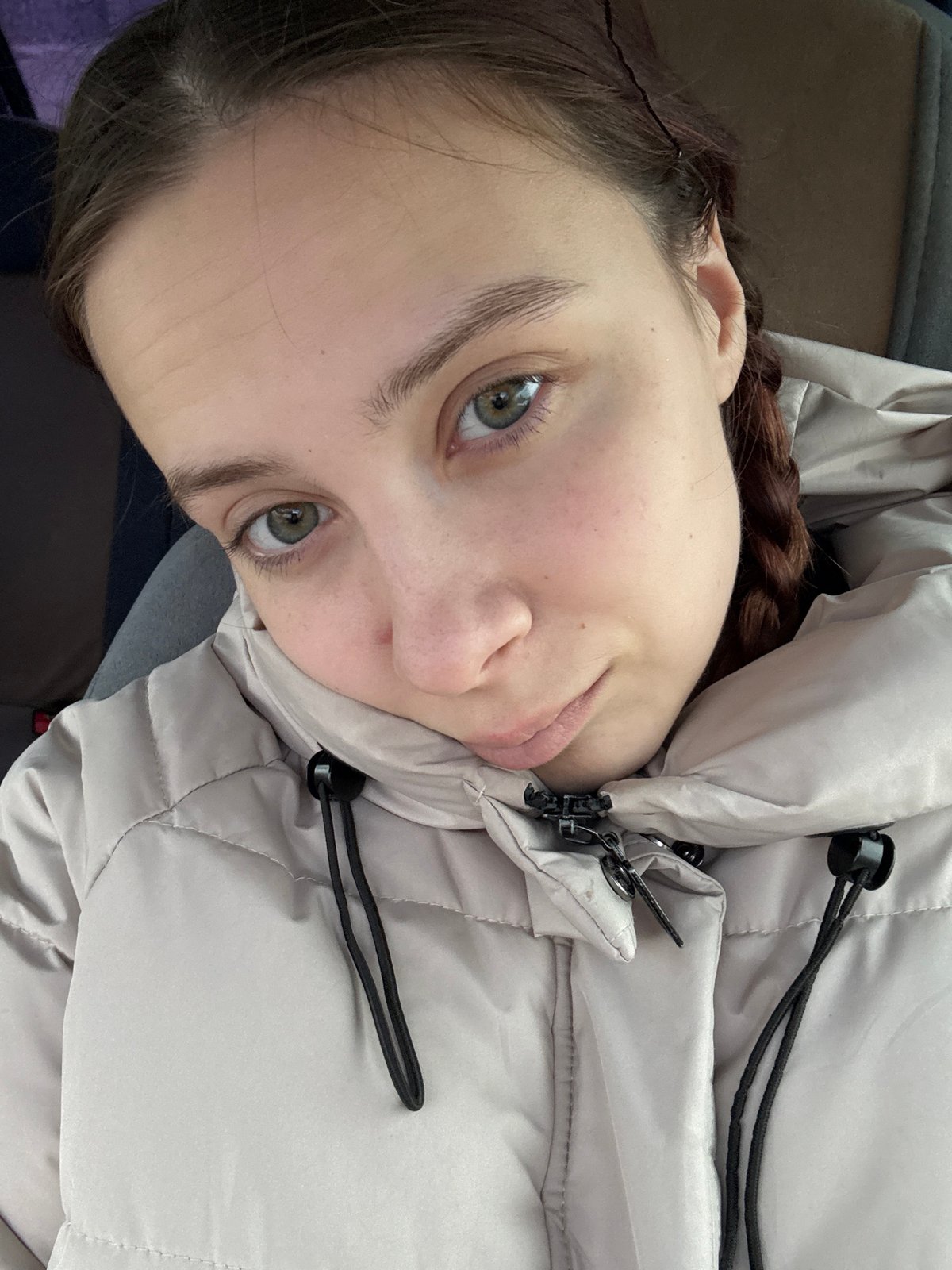 Woman takes selfies during rainy morning in Russian city