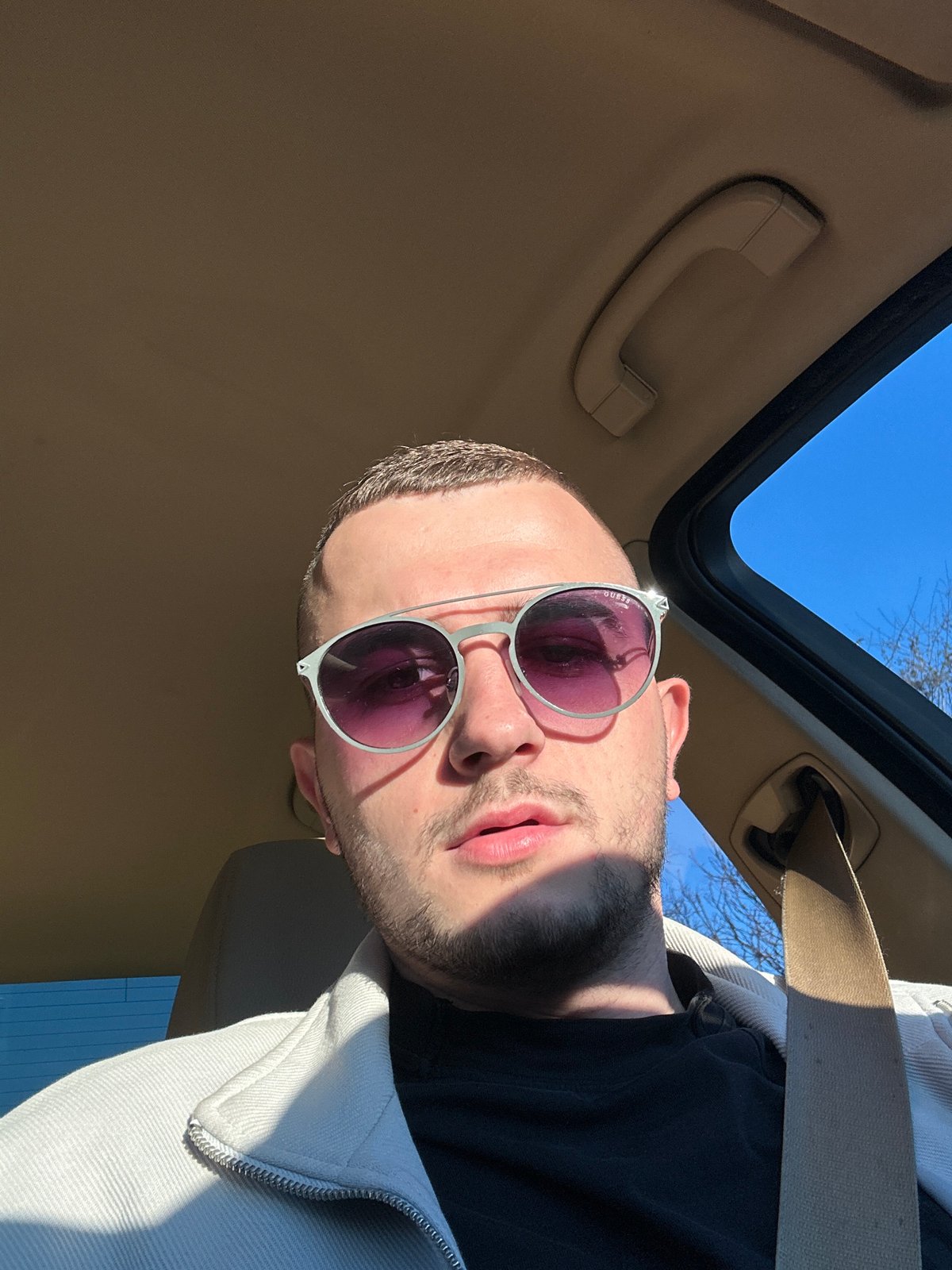 Man photographed through open sunroof in Plovdiv, Bulgaria