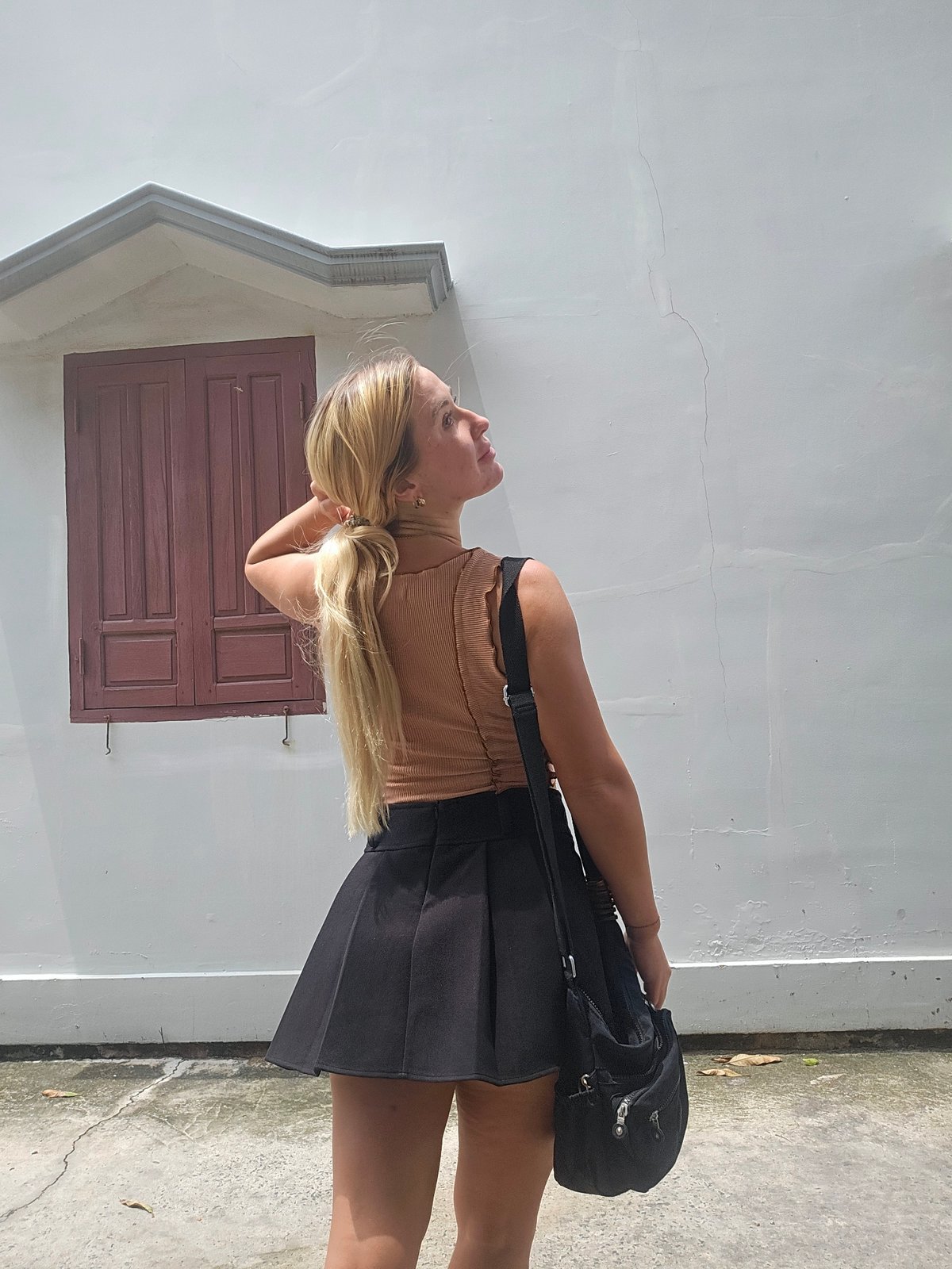 Casual outdoor photo session at a Mũi Né wall