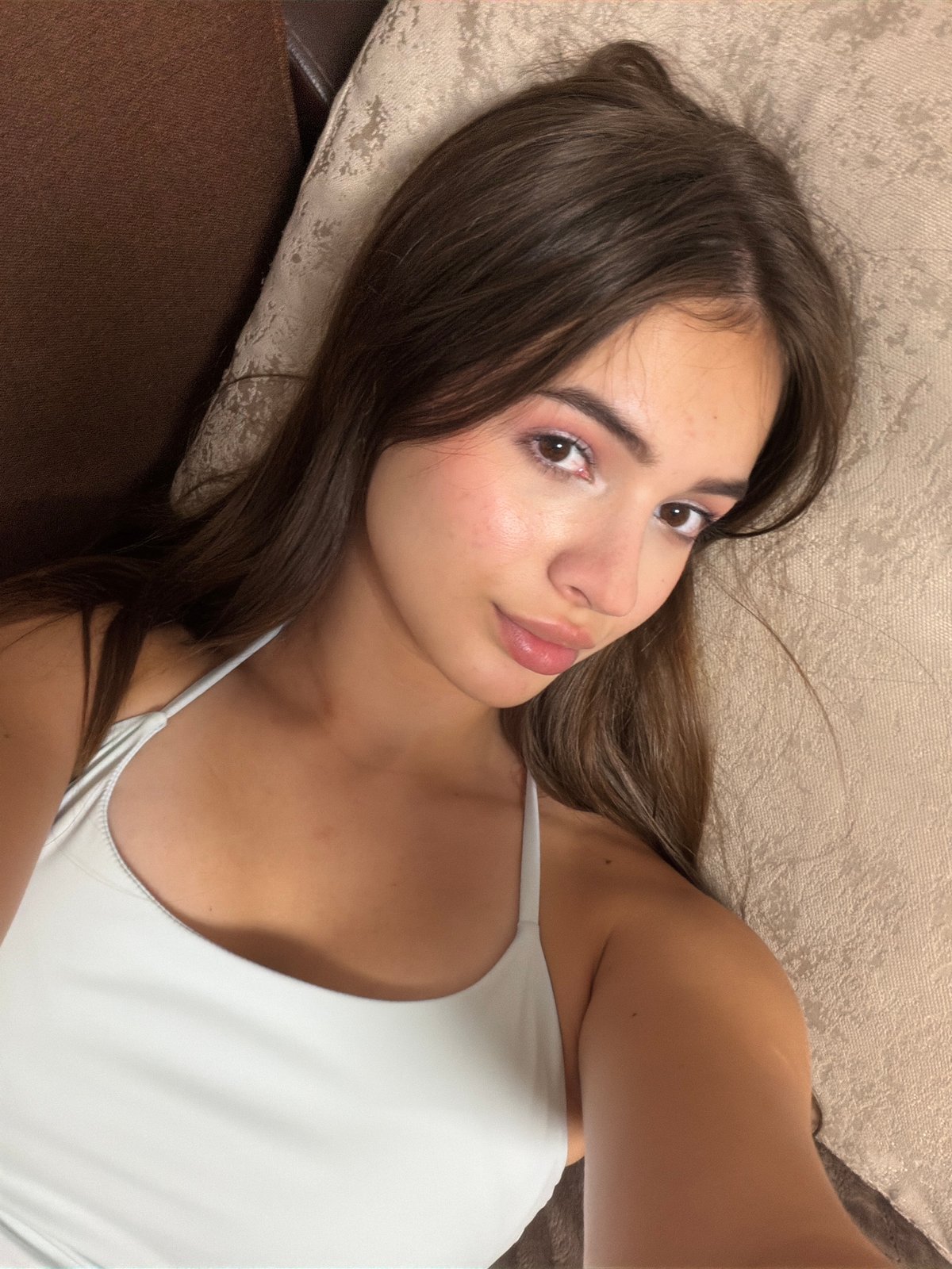 Overhead close-up of someone resting on a couch indoors