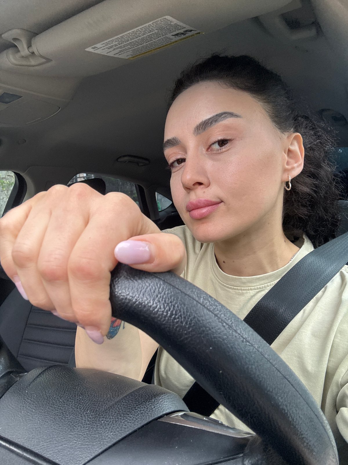 Woman observed driving in early morning Tbilisi traffic
