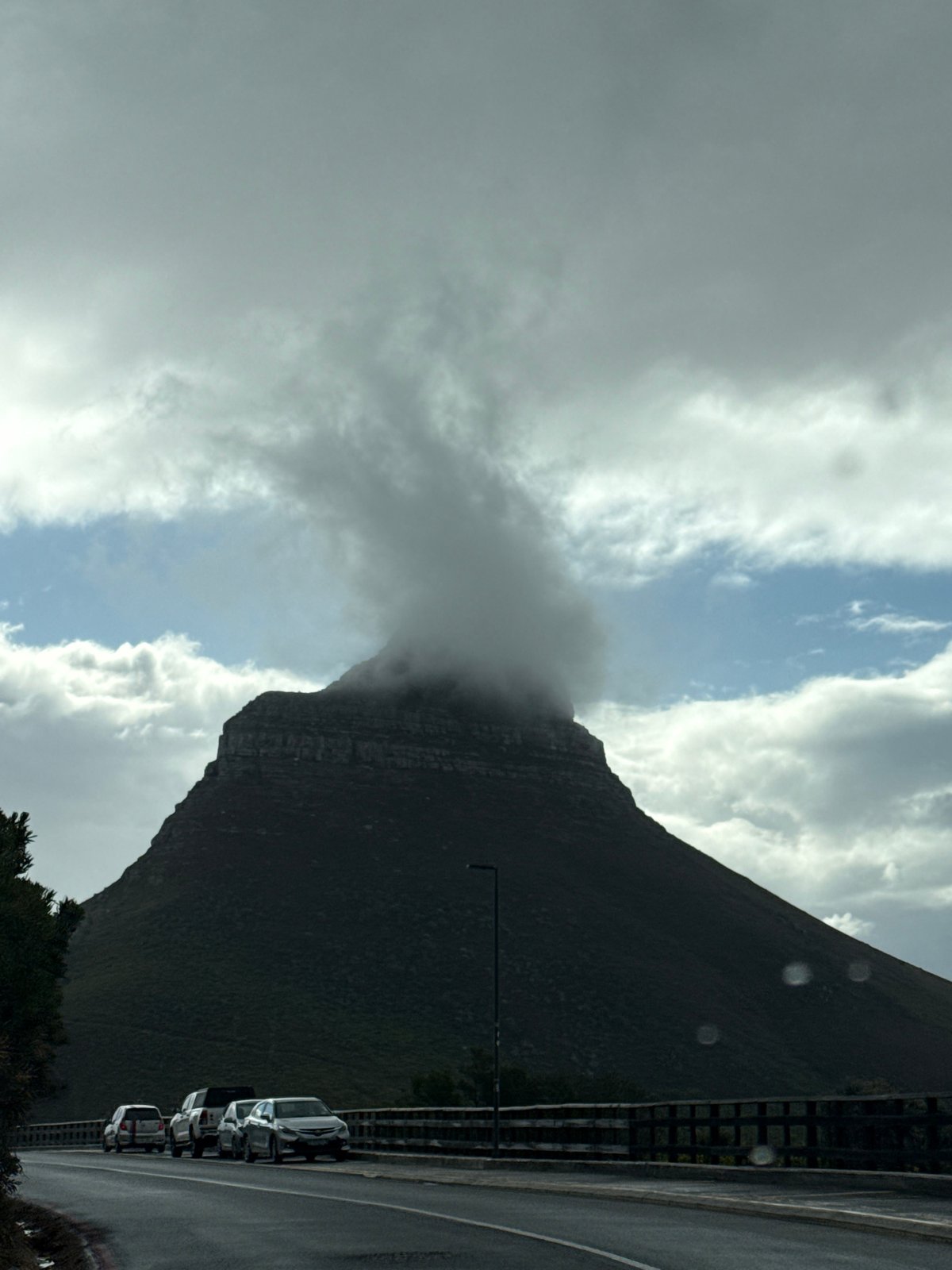 Cape Town mountains shrouded in clouds during overcast afternoon