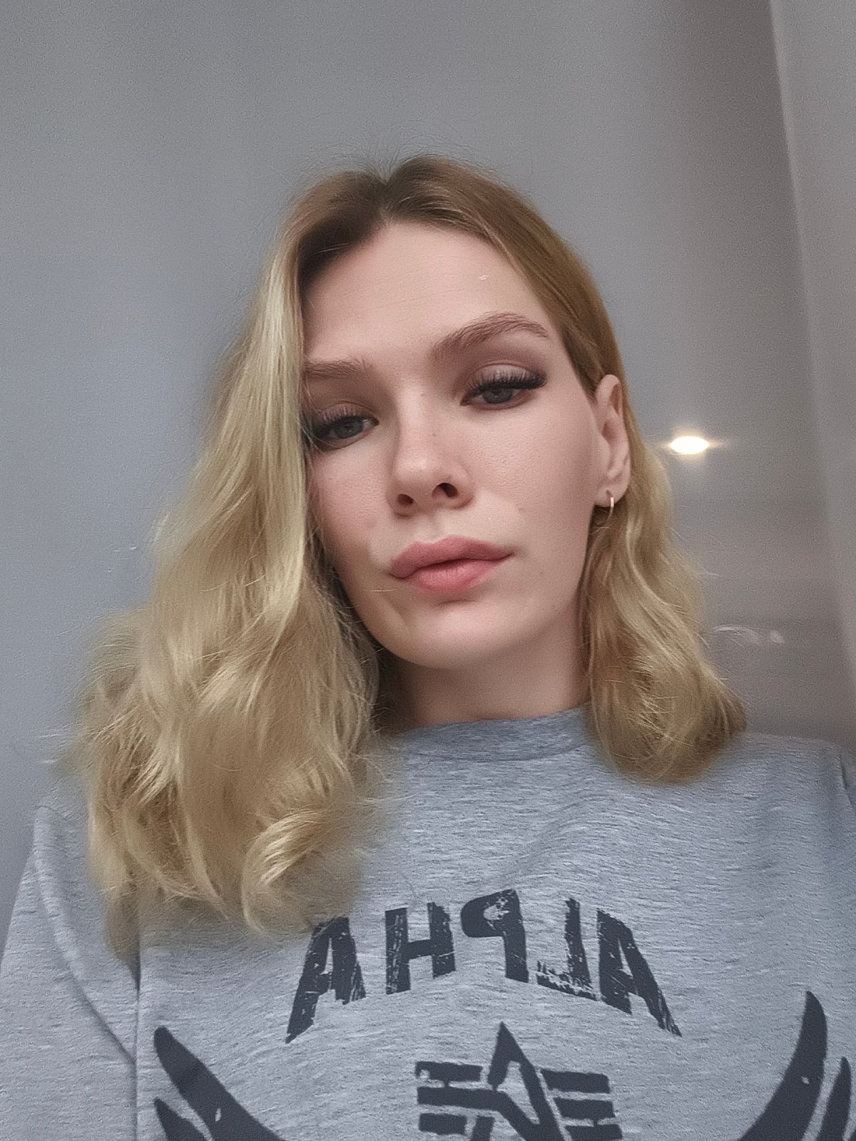Woman in ALPHA shirt photographed in Русский Вожой