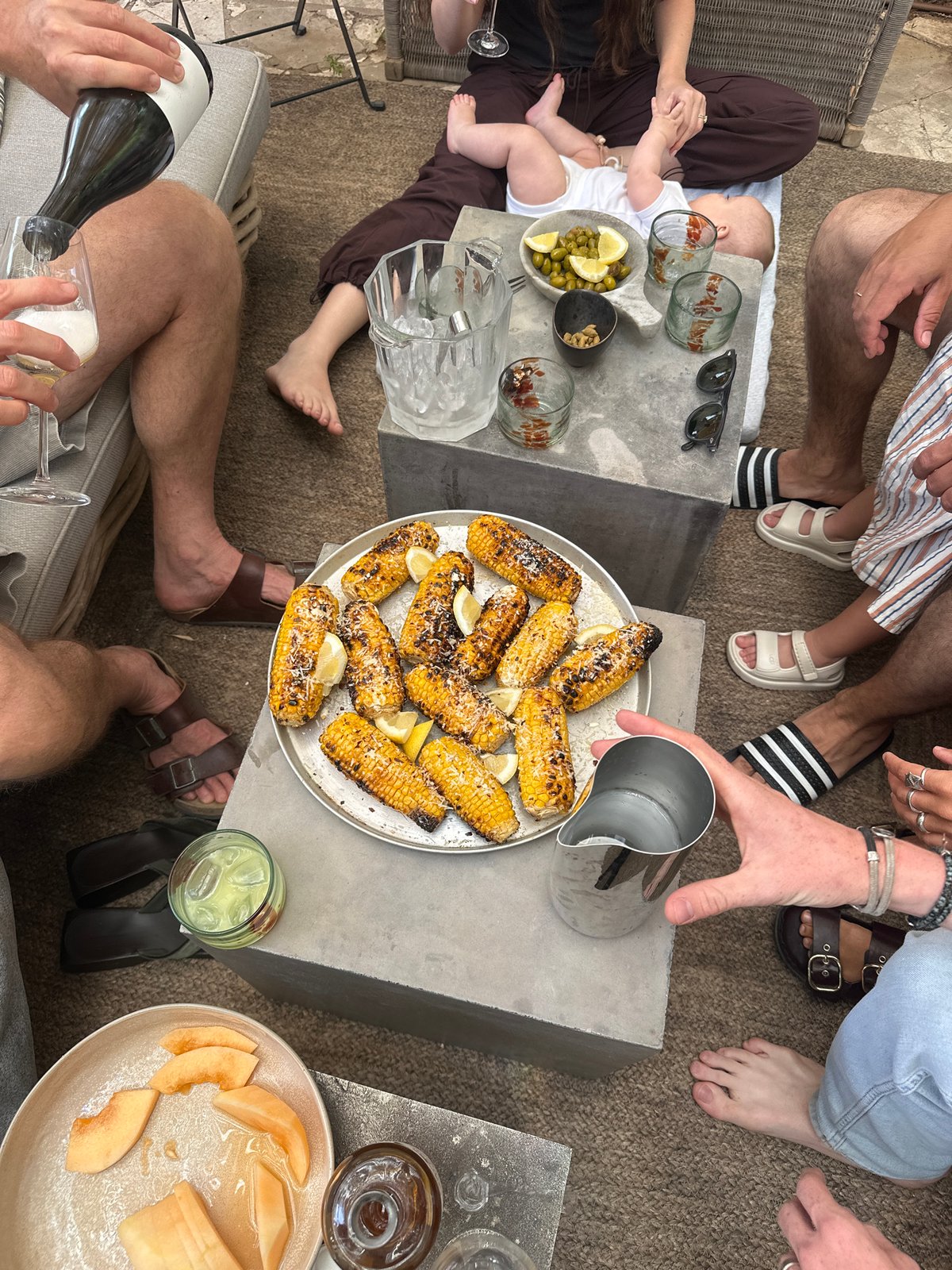 Casual garden gathering captured in Tel-Aviv outdoor dining scene