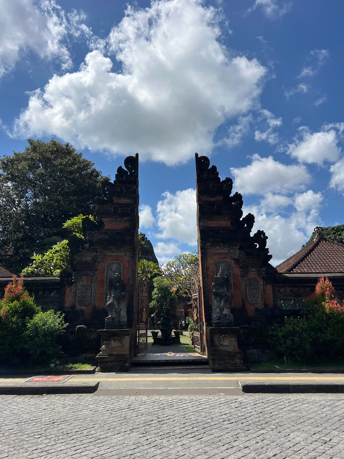 Traditional Balinese gate captured in Ubud under cloudy skies
