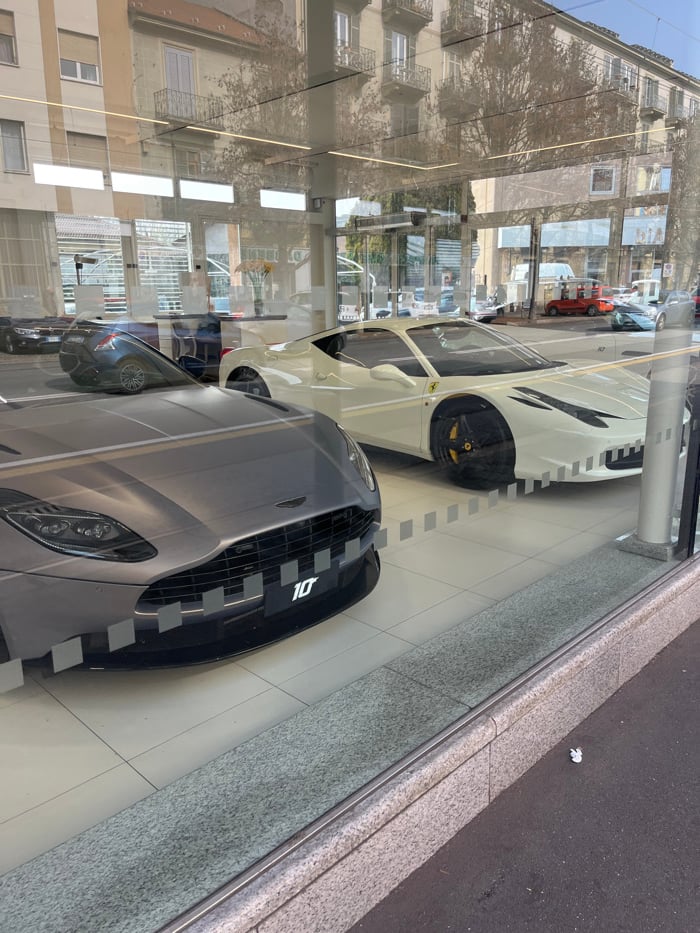 Luxury car dealerships showcase premium vehicles in Turin showrooms