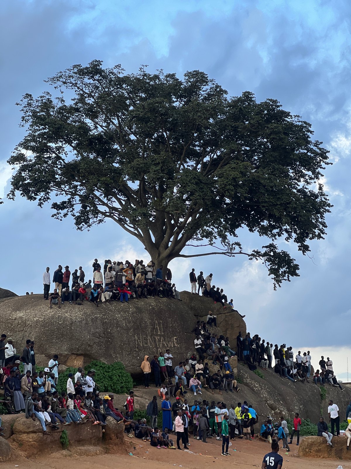 Informal football match draws a crowd at Jos rocky field