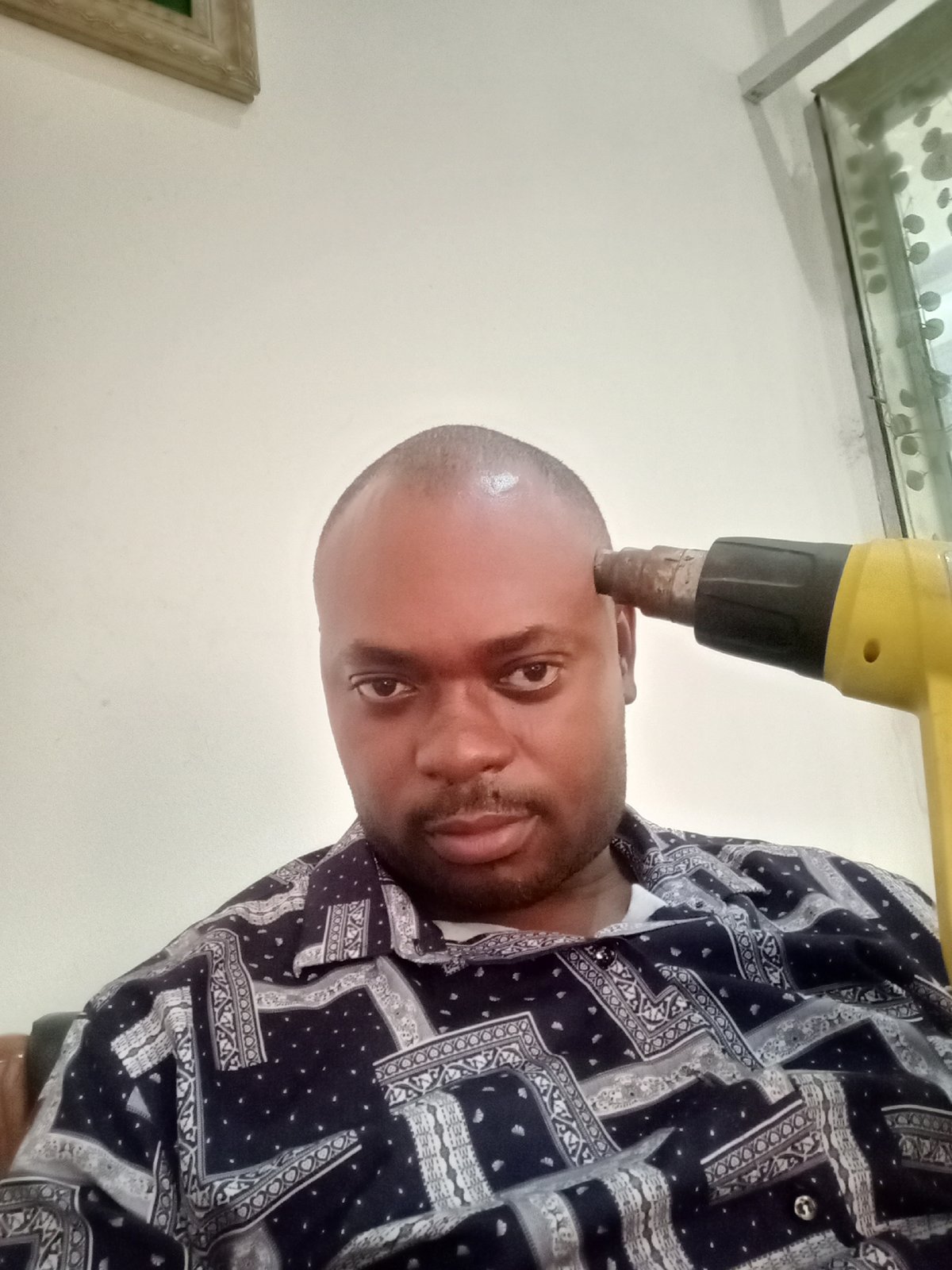 Man captured in casual moments during morning in Gwarinpa