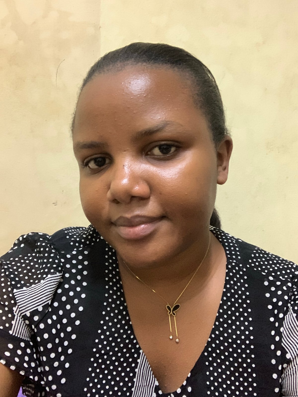 Woman takes selfies in bedroom in Dar es Salaam