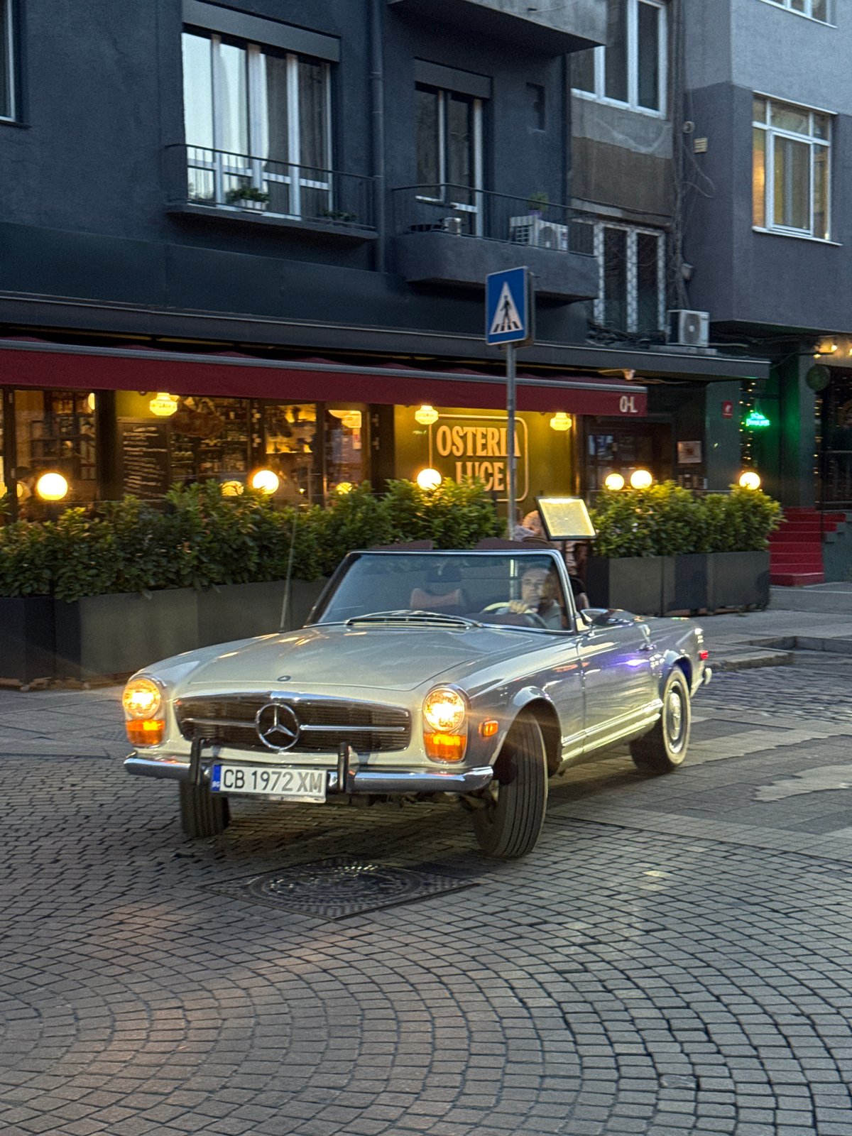 Ordinary life unfolds across Sofia during summer evening hours