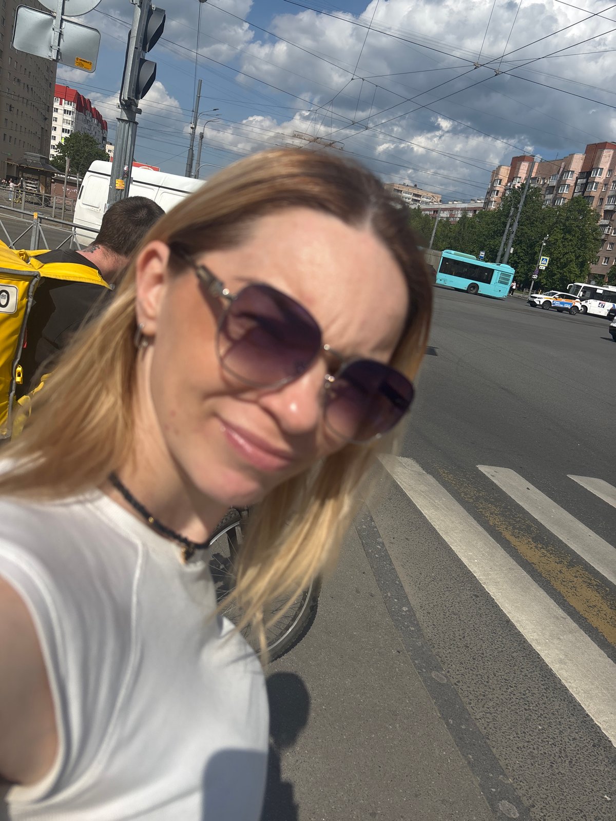 Woman documents afternoon street life and meal in Saint Petersburg
