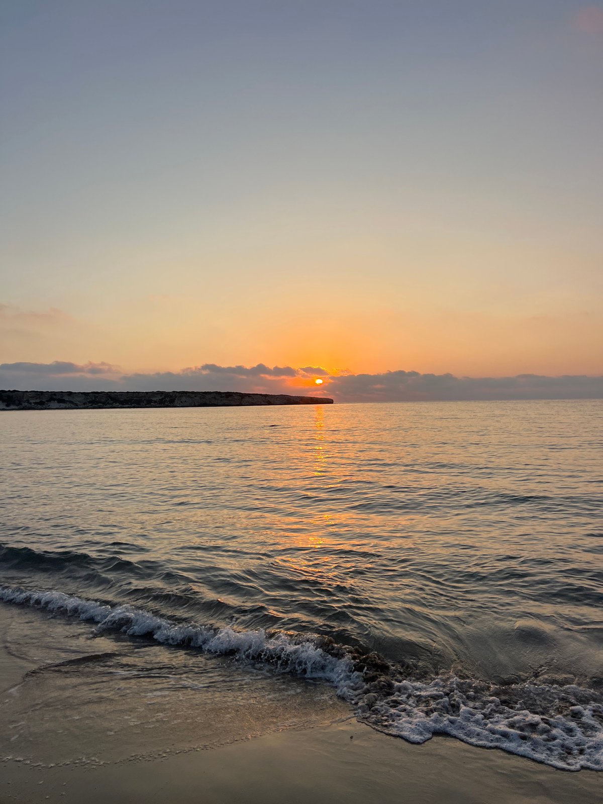 Sunset and calm waves along the Cyprus coastline near Ineia