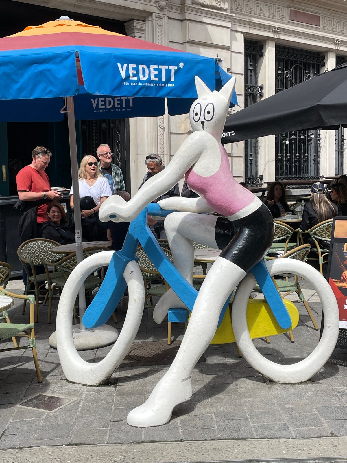 Tourist documents walking tour through central Brussels landmarks