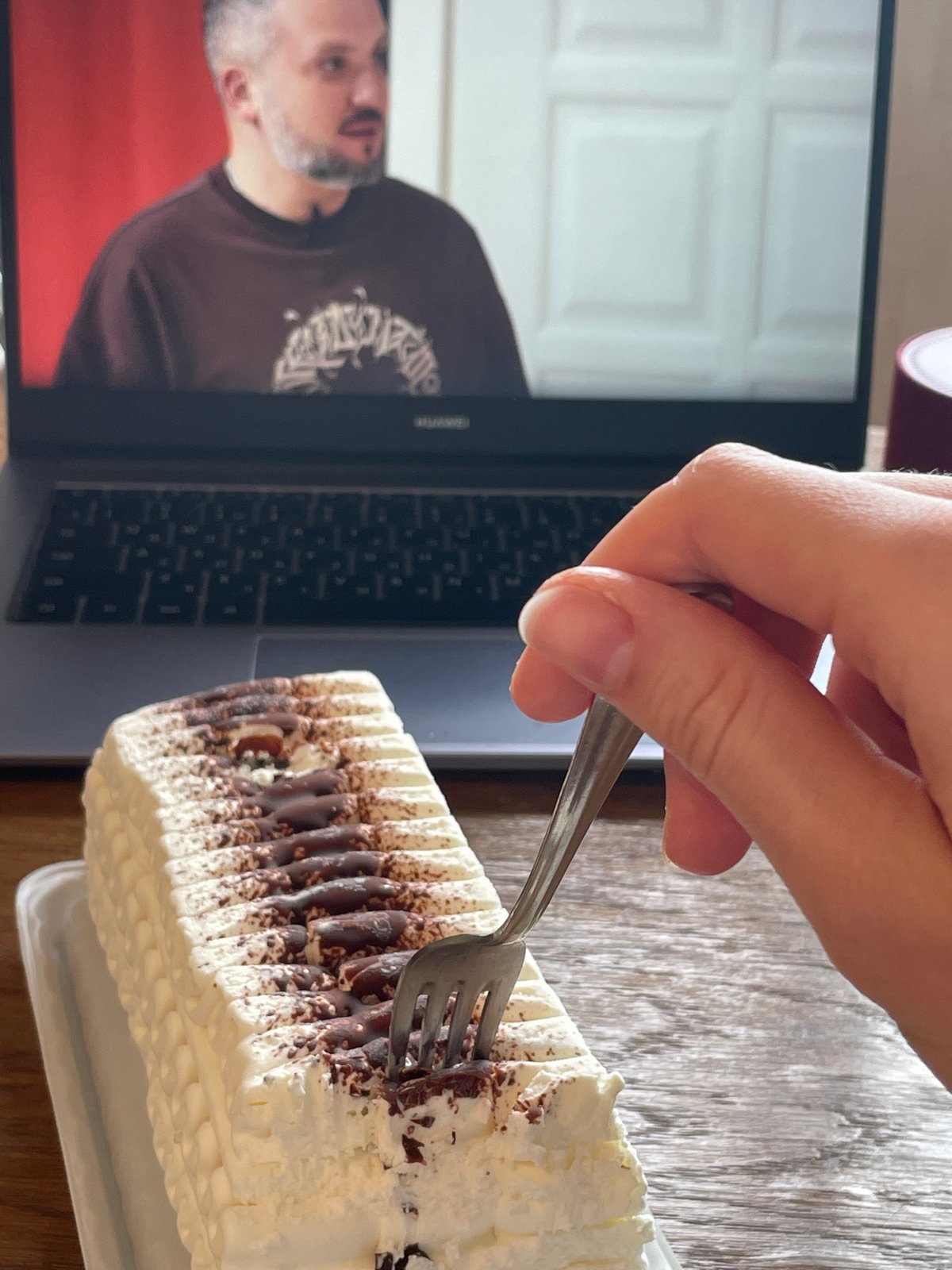 Woman enjoys layered ice cream cake in Moscow