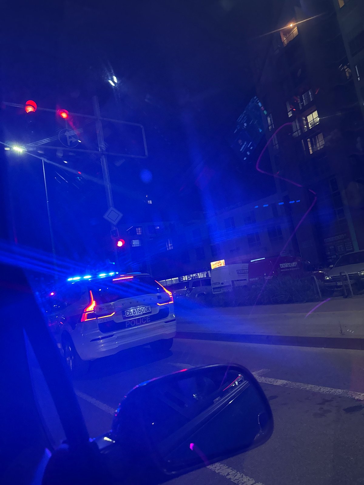 Police vehicle with emergency lights active at Plovdiv intersection
