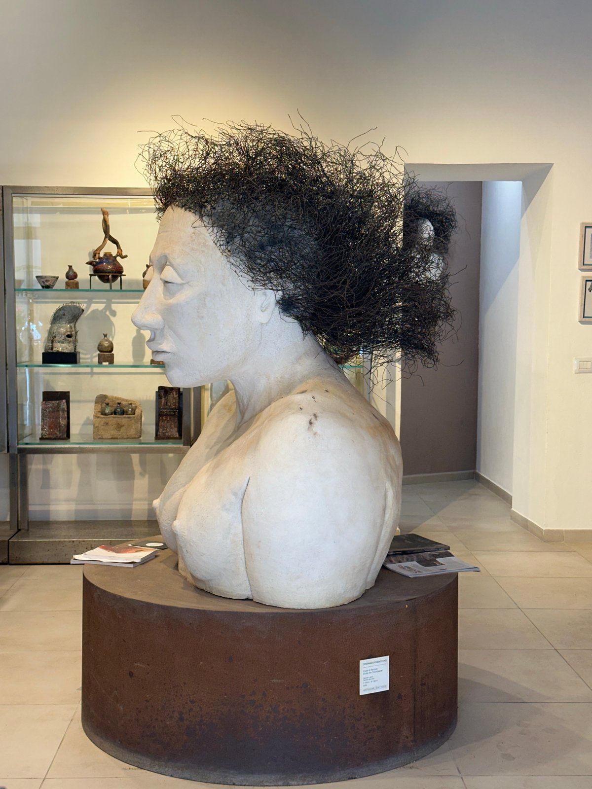 Tourist documents sculptures and fountains in historic Syracuse