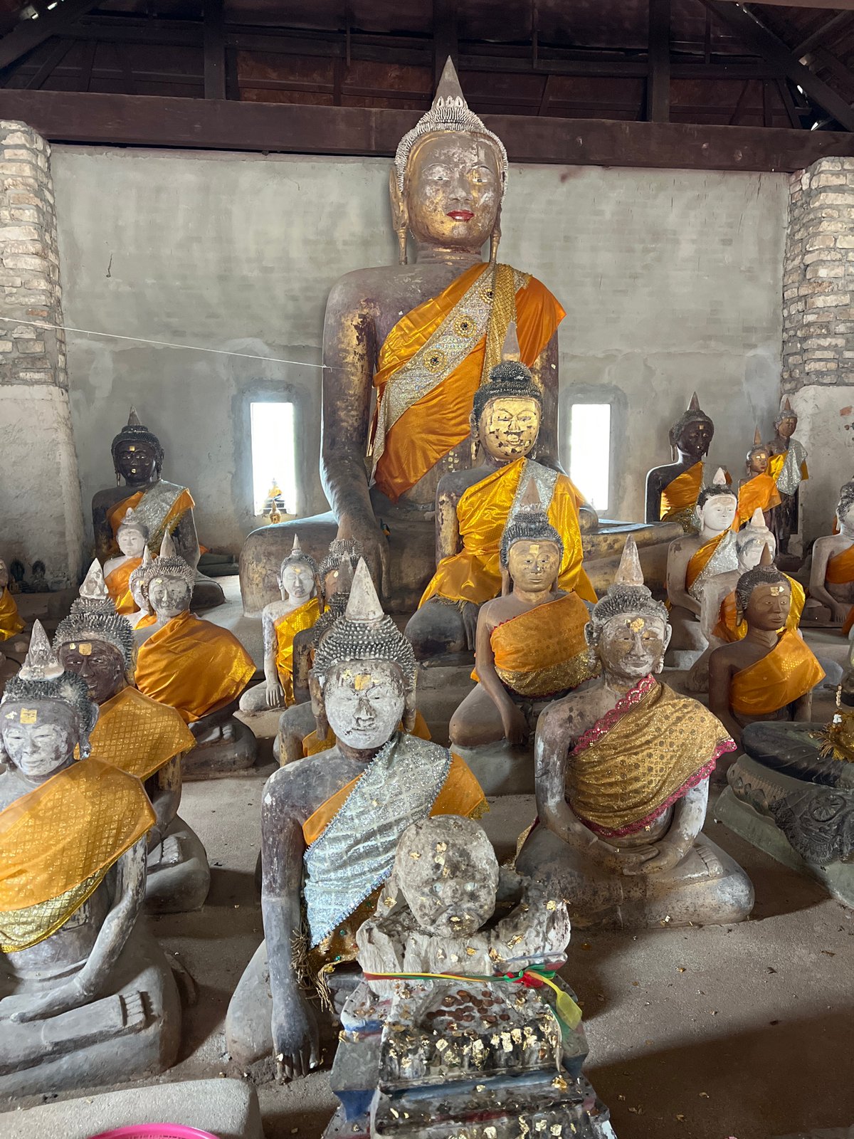 Inside and outside a statue-filled temple in Baan Harn