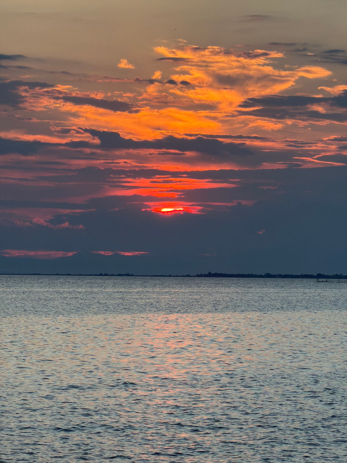 Red sunset over calm Aegean waters near Νέα Ηράκλεια