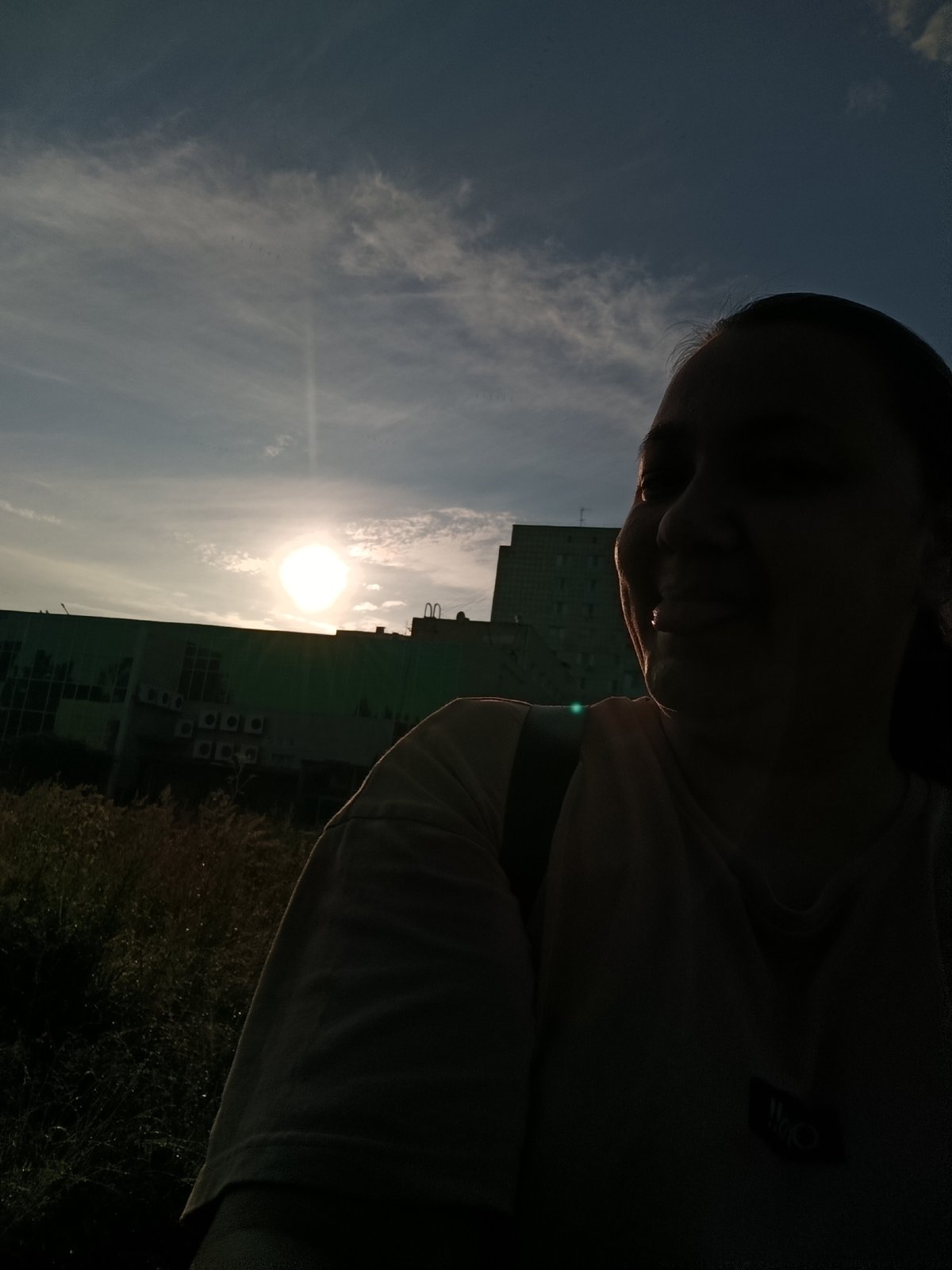 Outdoor selfie with cloudy sky and building in Chaikovsky