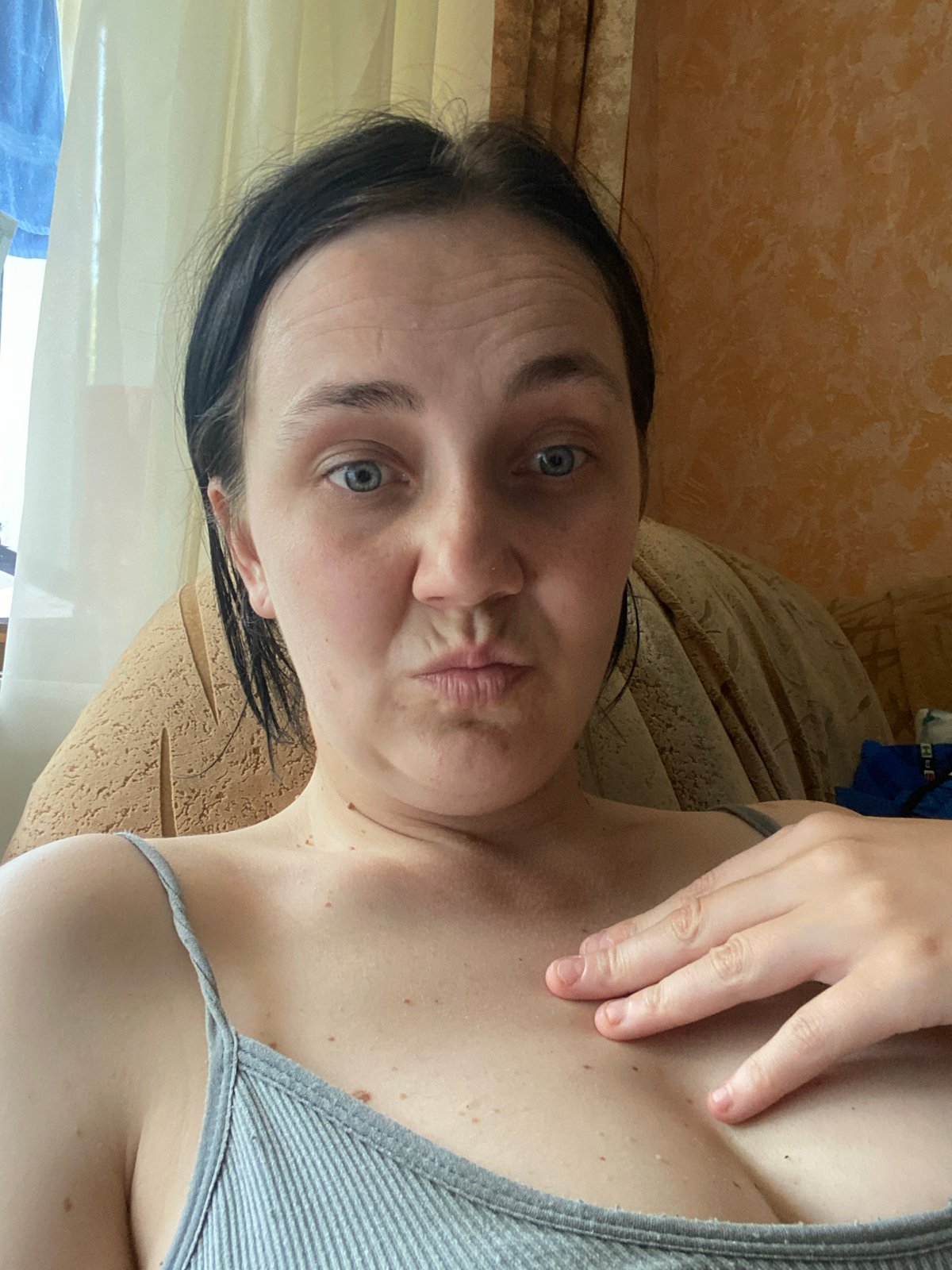 Gray tank top selfie series, multiple expressions