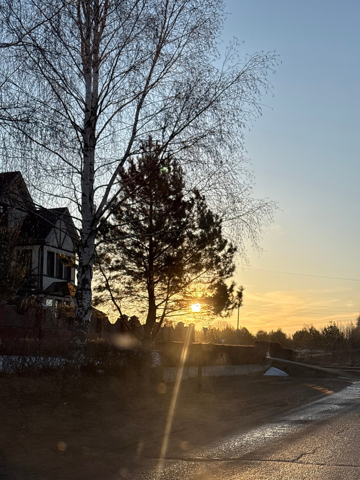Woman travels through residential Прикамский during sunrise