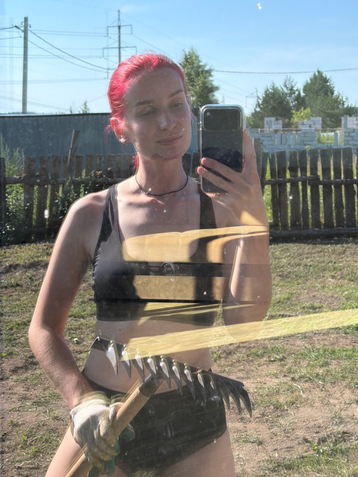 Selfie series with gardening tools under a blue Chaikovsky sky