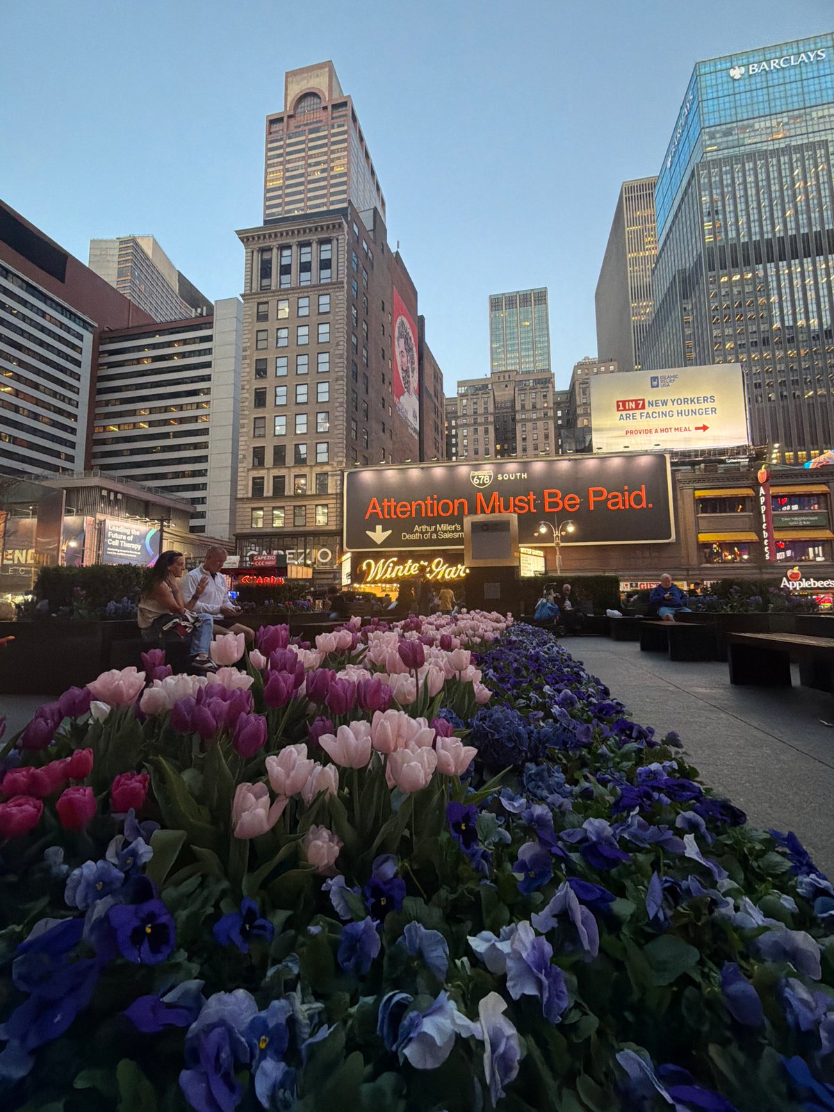 NYC street scene captured with prominent billboard message